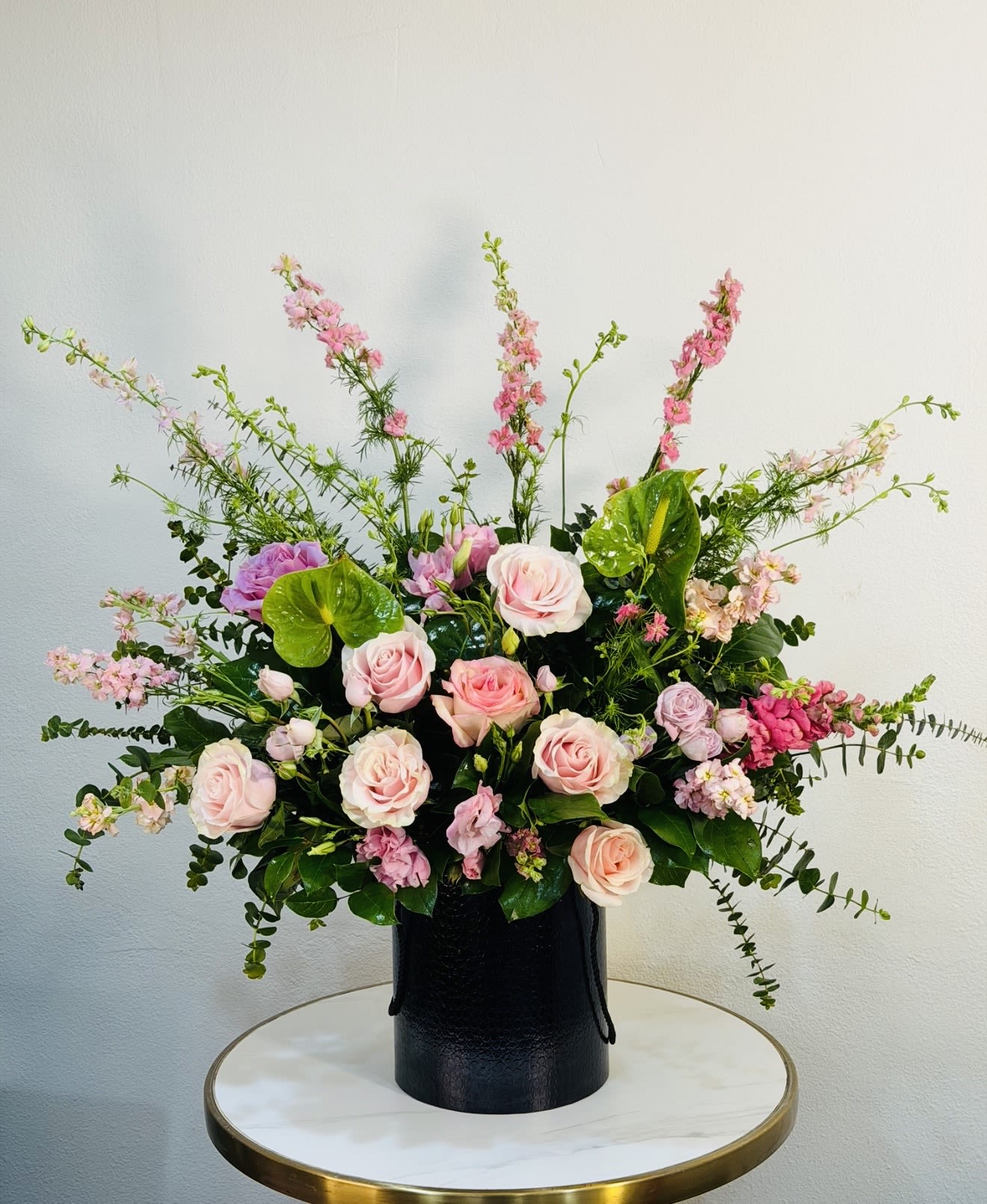  Blush Reverie - Blush Reverie is a dreamy and elegant floral arrangement featuring premium blush pink roses, delicate seasonal blooms, and lush greenery, all beautifully arranged in a modern black vase. This design captures softness, romance, and refined luxury perfect for birthdays, celebrations, or a truly unforgettable gift. Available for same-day flower delivery from our studio. We proudly serve: Beverly Hills, Bel-Air, West Hollywood, Beverly Grove, Culver City, Hollywood, Hollywood Hills, Santa Monica. Each arrangement is handcrafted with the freshest flowers and attention to every detail.