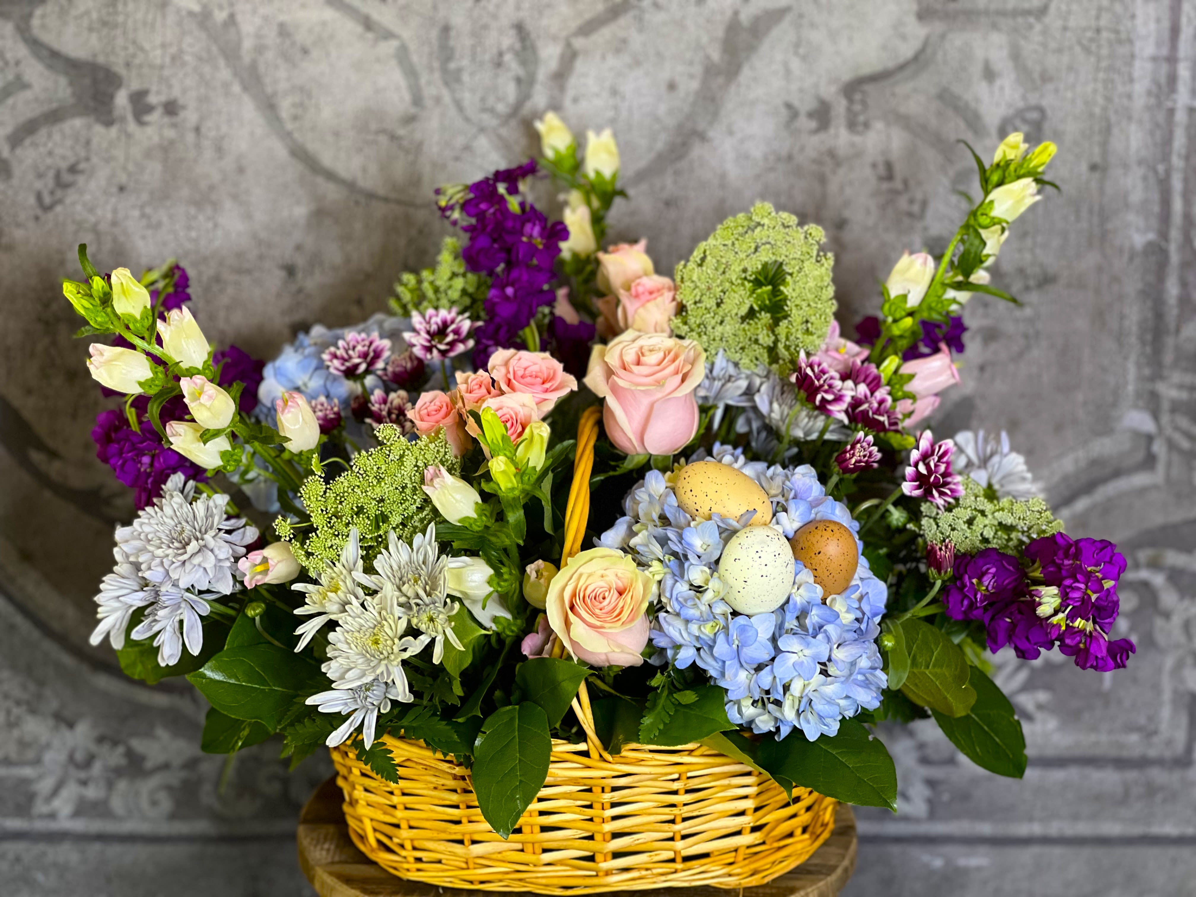 The De La Flor Easter Basket - Enjoy a beautiful mix of spring flowers in soft pastel colors.