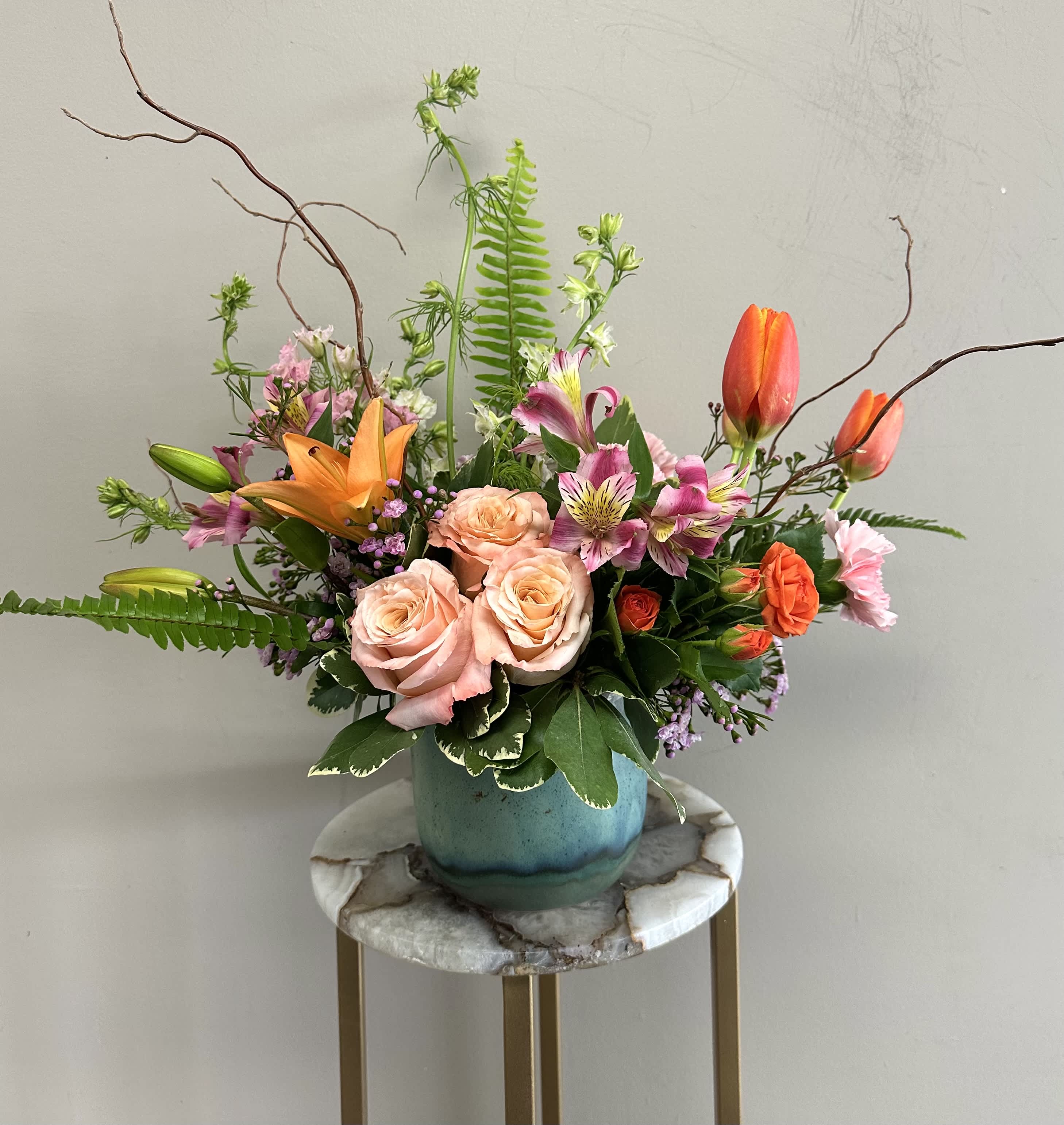Soleil - A fresh mix of bright, spring floral in a gorgeous blue ceramic vase.