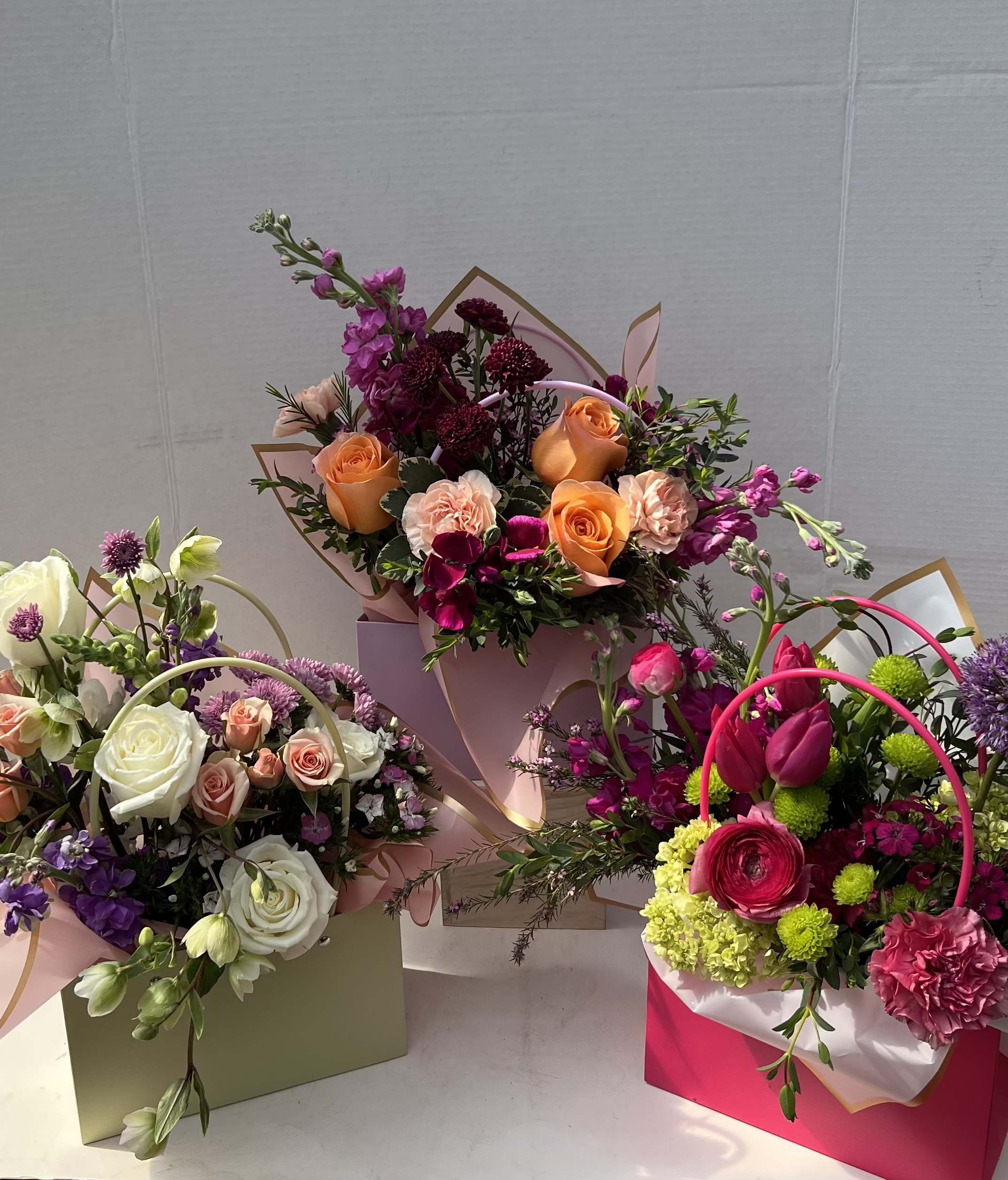 The Bouquet Baglet - Our Blooming Baglet Purses are thoughtfully designed arrangements, blending soft, feminine colors with touches of vibrant and pastel tones. Each piece is uniquely styled, making no two exactly alike. Perfectly elegant and full of charm, they’re a lovely way to celebrate someone special.