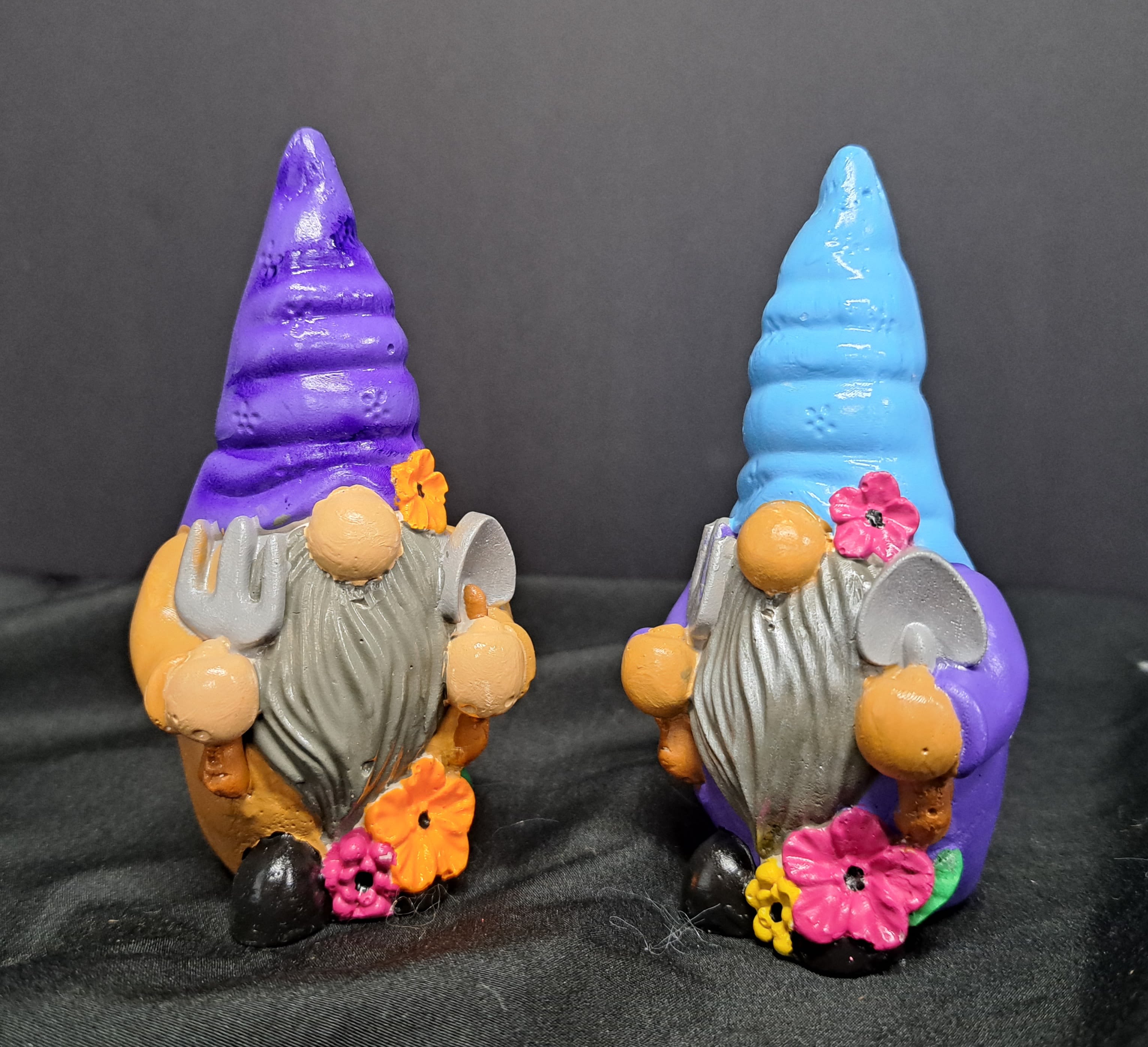 Garden Gnome - This cheerful gnome figurine bring a playful twist to a flower arrangement, perfect as a lighthearted gift or everyday decorative accent for a birthday, housewarming, or just-because surprise. The design reads as a whimsical garden scene-an ideal choice when you want the person you're thinking of to smile and feel delightfully noticed rather than formally congratulated. 