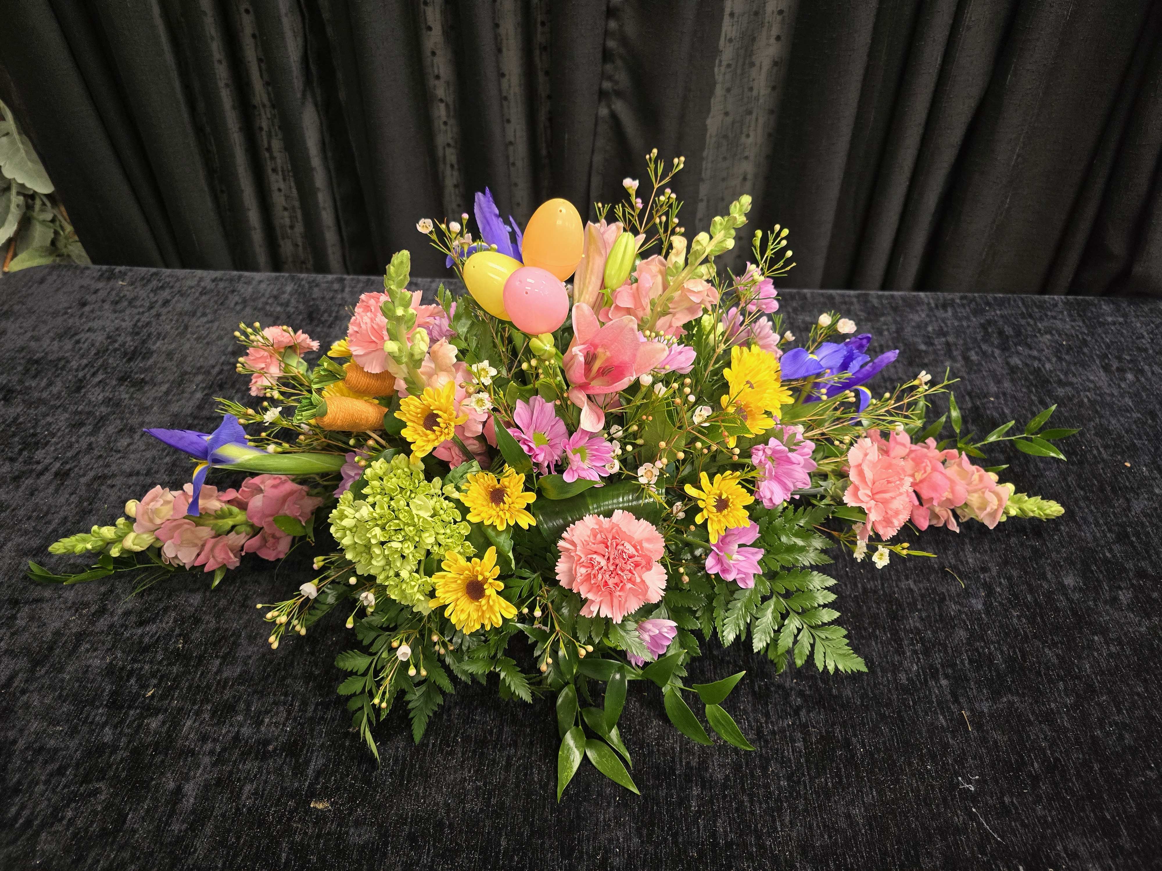 Easter table centerpiece. - A dazzling centerpiece made with snapdragons, iris, daisies and lilies.  Perfect gift for your families Easter table.