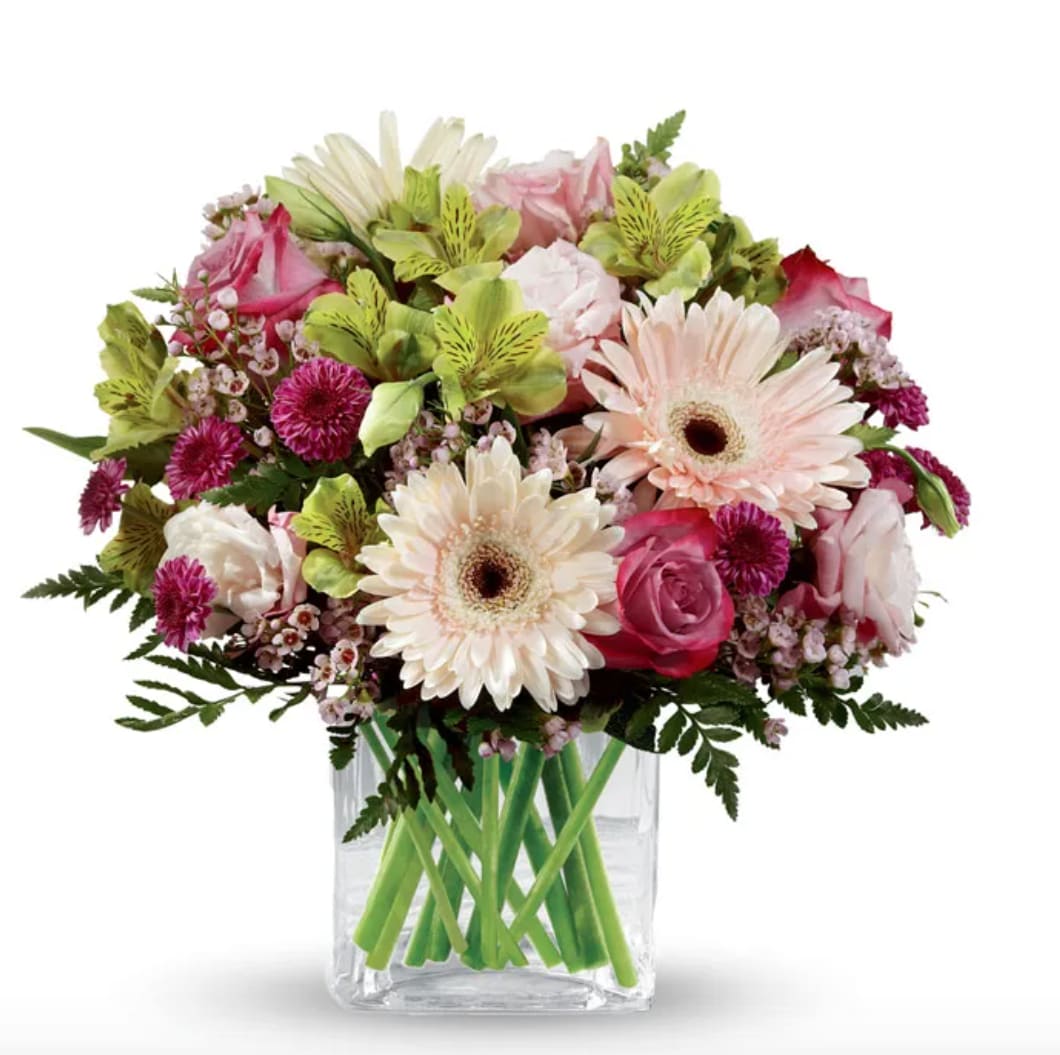 Mystic Garden - Mystic Garden Bouquet — a dreamy blend of pale pink gerbera daisies, lavender or blush roses, soft pink / purple stock, green button mums, clusters of pink waxflower, alstroemeria, and delicate filler blooms. Beautifully accented with lush greenery and artistically arranged in a modern style.