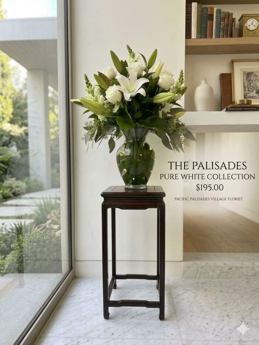 Pure White Collection - A refined arrangement of white lilies and roses, with soft blooms at varying stages for depth and elegance. Lush green foliage frames the flowers, enhancing the clean, fresh, and timeless look.