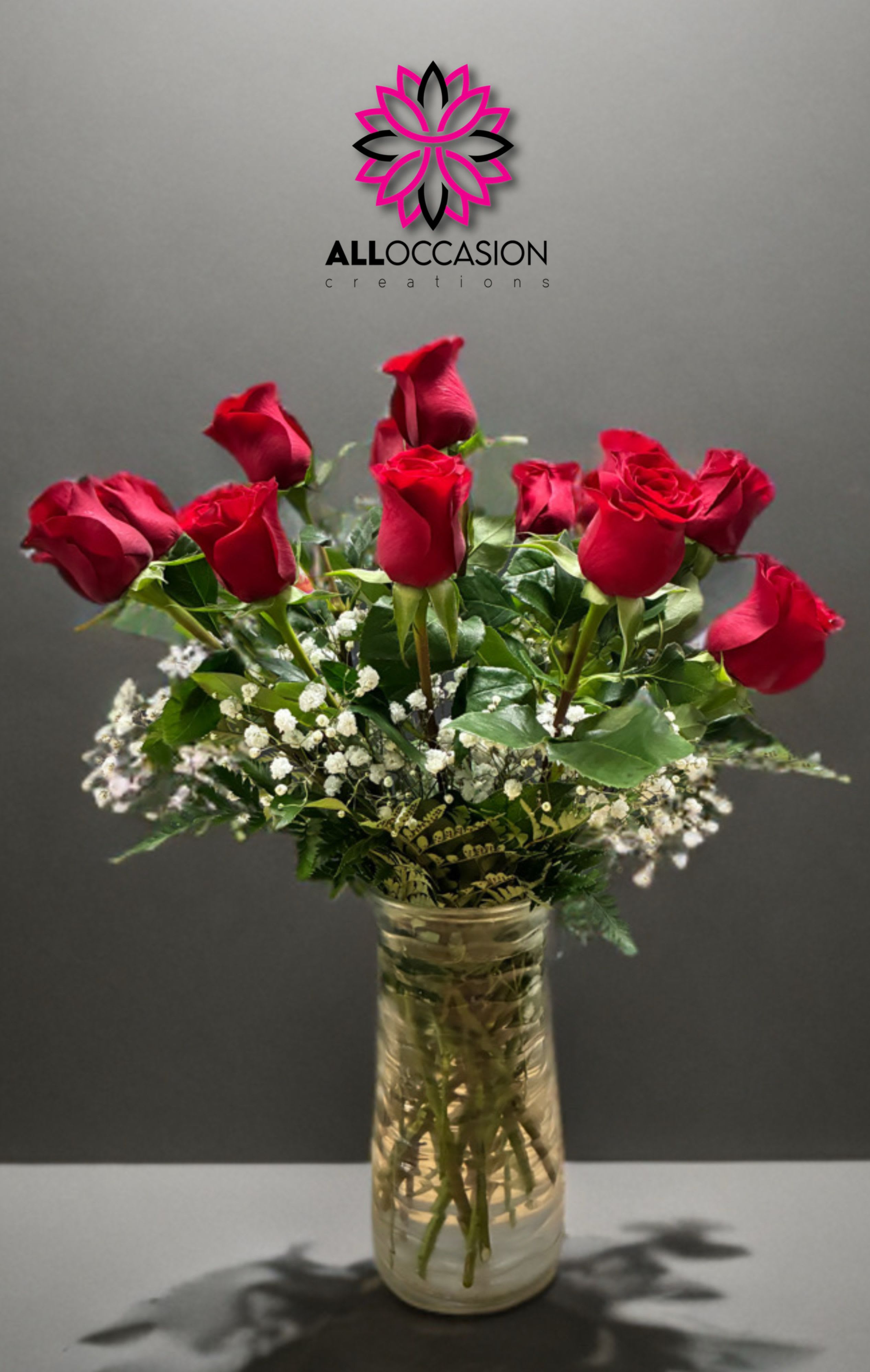 Dozen Long Stemmed Red Roses with Baby's Breath by BloomNation™ - These dozen red roses with baby's breath are classic! Perfect romantic gift for Valentine's Day or an Anniversary.   APPROXIMATE DIMENSIONS: 25" H X 18" W