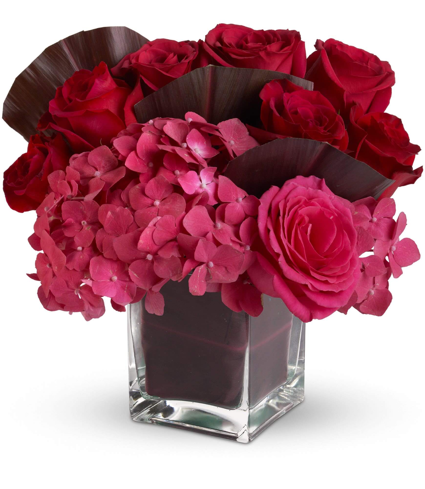 Pure Desire by Teleflora - You can almost feel the heat from this ravishingly red bouquet of floral favorites in a sleek glass cube vase. Send it to someone you love - or would like to love - and wait for the fireworks to start. T549-1A