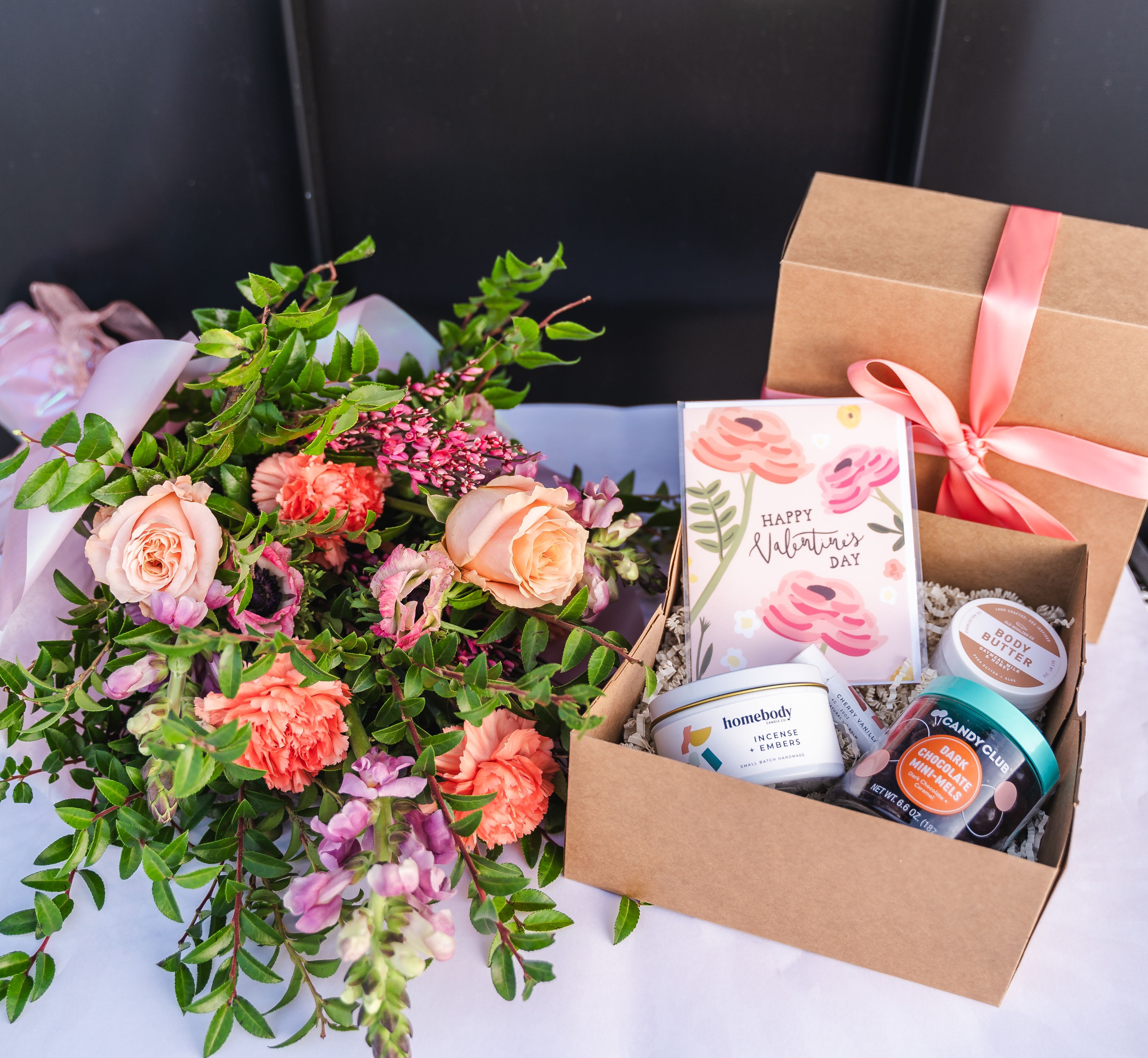 Flower Bundle + Gift Box - A gorgeous bouquet and gift box that make the perfect combo! Gift box starts out with a sweet treat, a facemask, greeting card, body butter, nail file and socks! Upgrade for a larger bouquet and more fun items in the gift box!  (Substitutions may occur as needed)