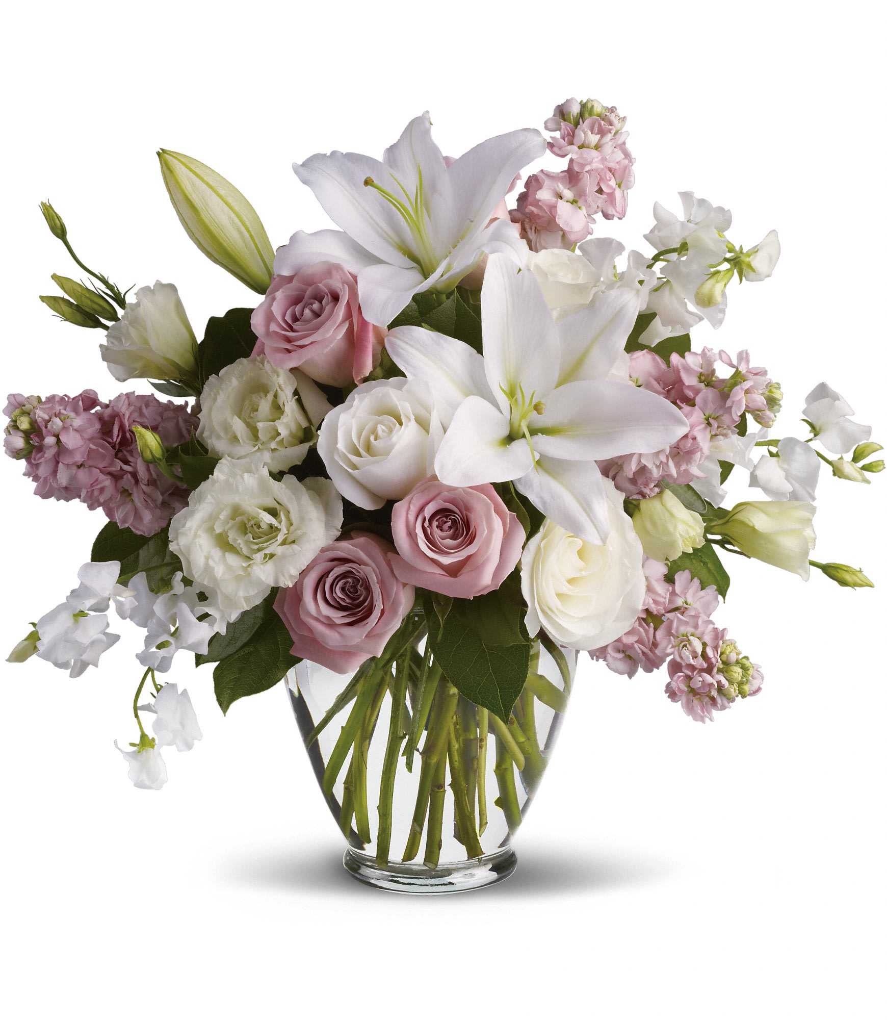 Isn't It Romantic - Tonight will certainly be romantic if you send this classic arrangement today! Beautiful hues and gorgeous blossoms will deliver your love. T9-1A