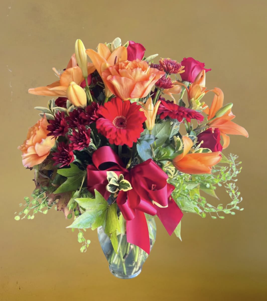 Autumn Blossoms by D'Lily's Flowers  - A stunning autumn mix of flowers to enjoy the autumn season. Includes lily's, gerbera daisies, roses, with complimentary greens. 