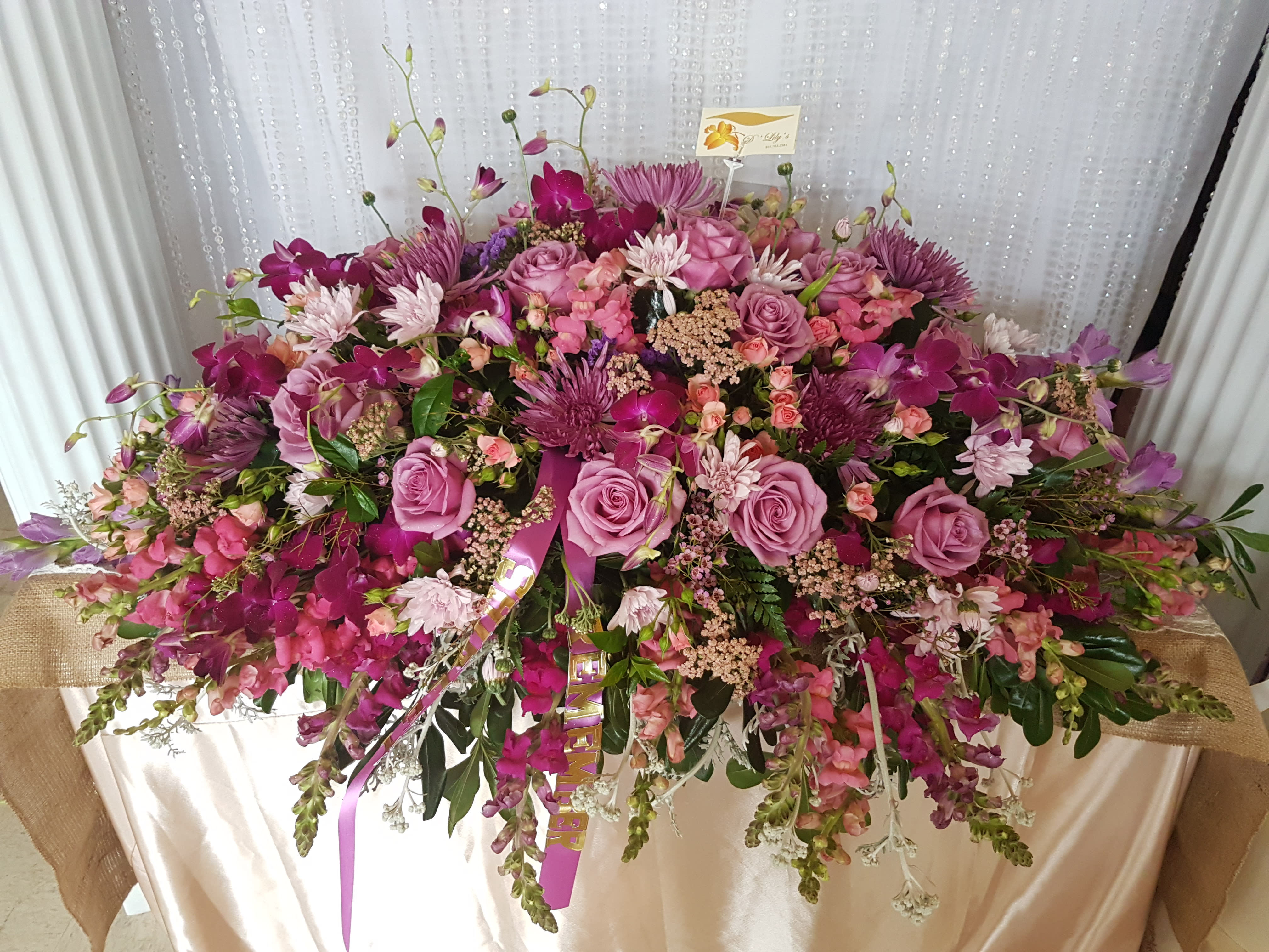 Burst of Purples - This elegant casket design  consists of your lovely pinks, lavenders, and purple tones.