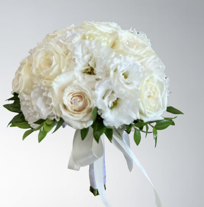 White Elegance  - An elegant mix of red roses, red calla lilies, white stephanotis, and green viburnum.   Disclaimer: Flowers may be substituted if needed to.