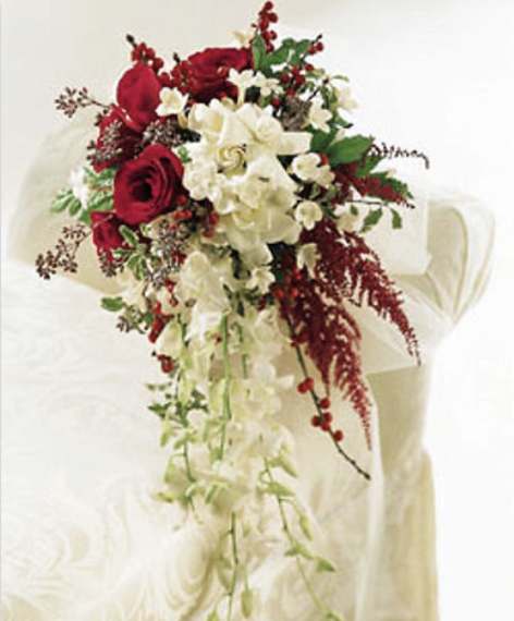 Luxury Love  - A grand mix of beautiful flowers. Mix of roses, gardenias, orchids, amaranthus, ilex berries and a couple stephanotis.   Disclaimer: Flowers may be substituted if needed to.