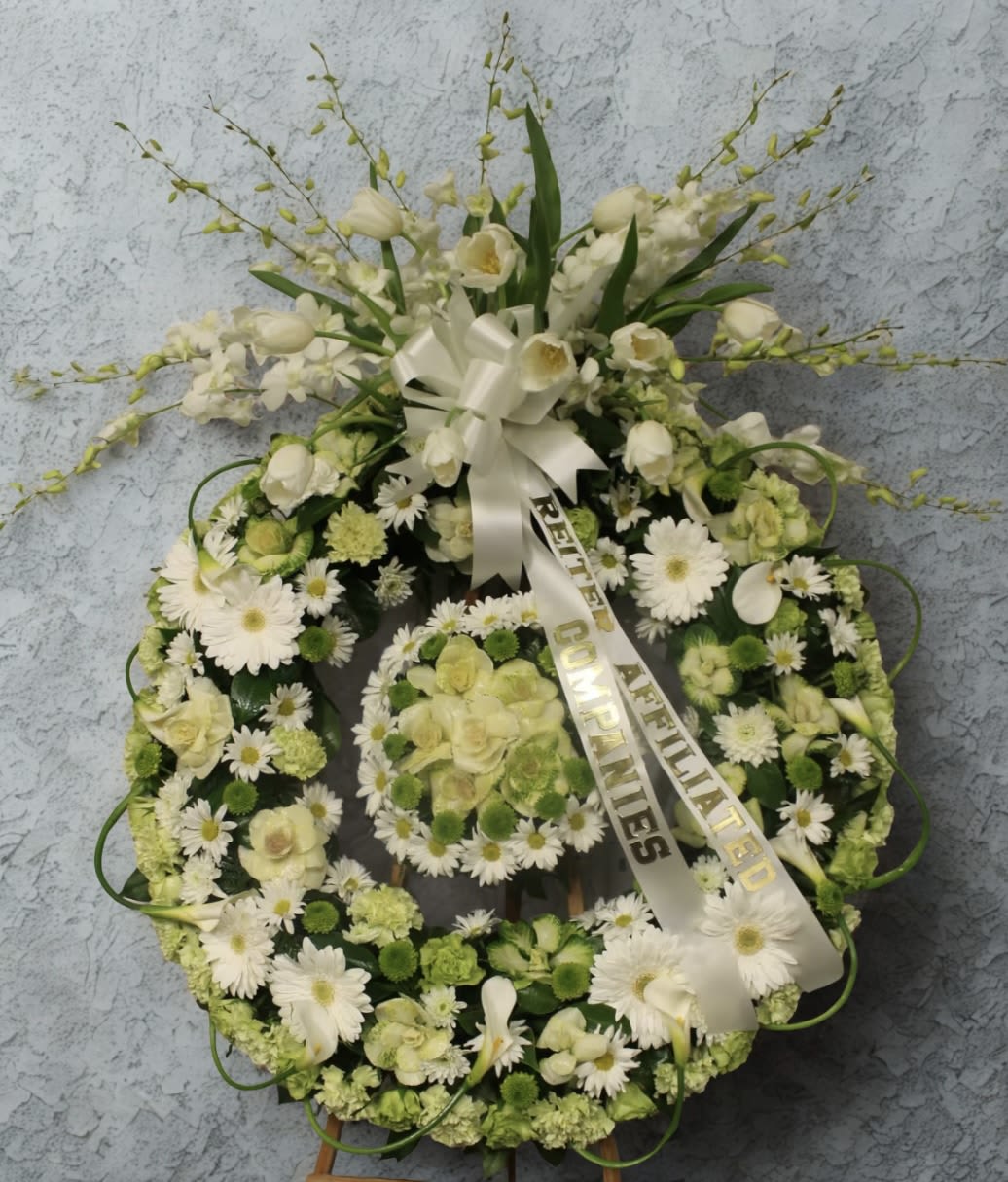 Orchid Top - A very nice and modern looking wreath full of whites and green. The size on picture displayed is the deluxe size.   DOES NOT INCLUDE RIBBON