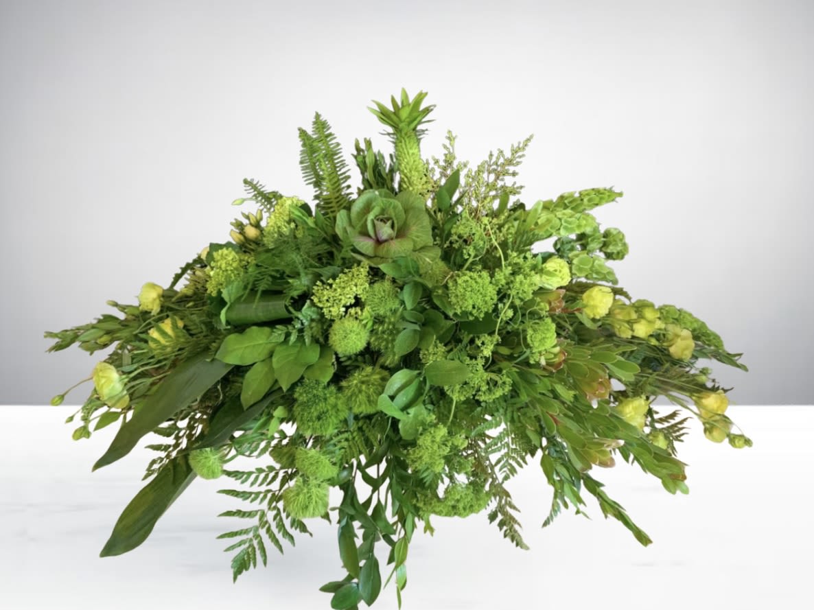 Green Wonder - Take a natural look with this all green flower casket for your loved one. Disclaimer: Flowers may be substituted if needed.