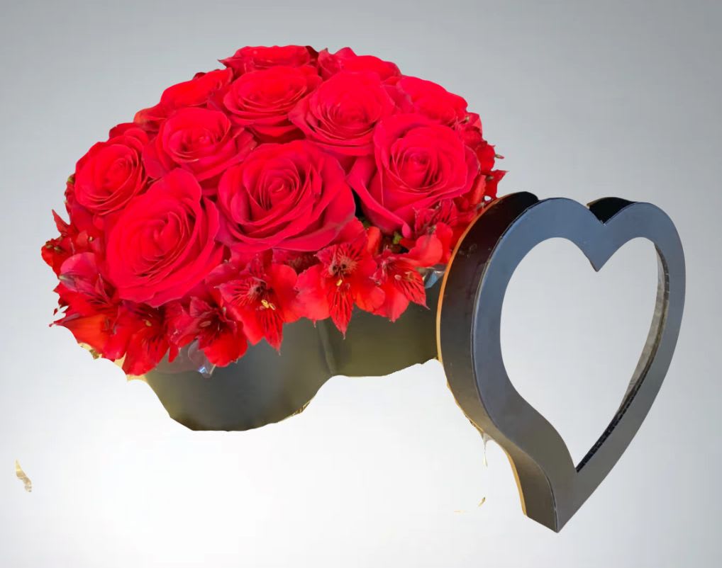Black &amp; Red Elegance  by D'Lily's Flowers  - This black heart shaped box counteracts the beautiful reds making them stand out and gives it an elegant look. Perfect for any occasion.