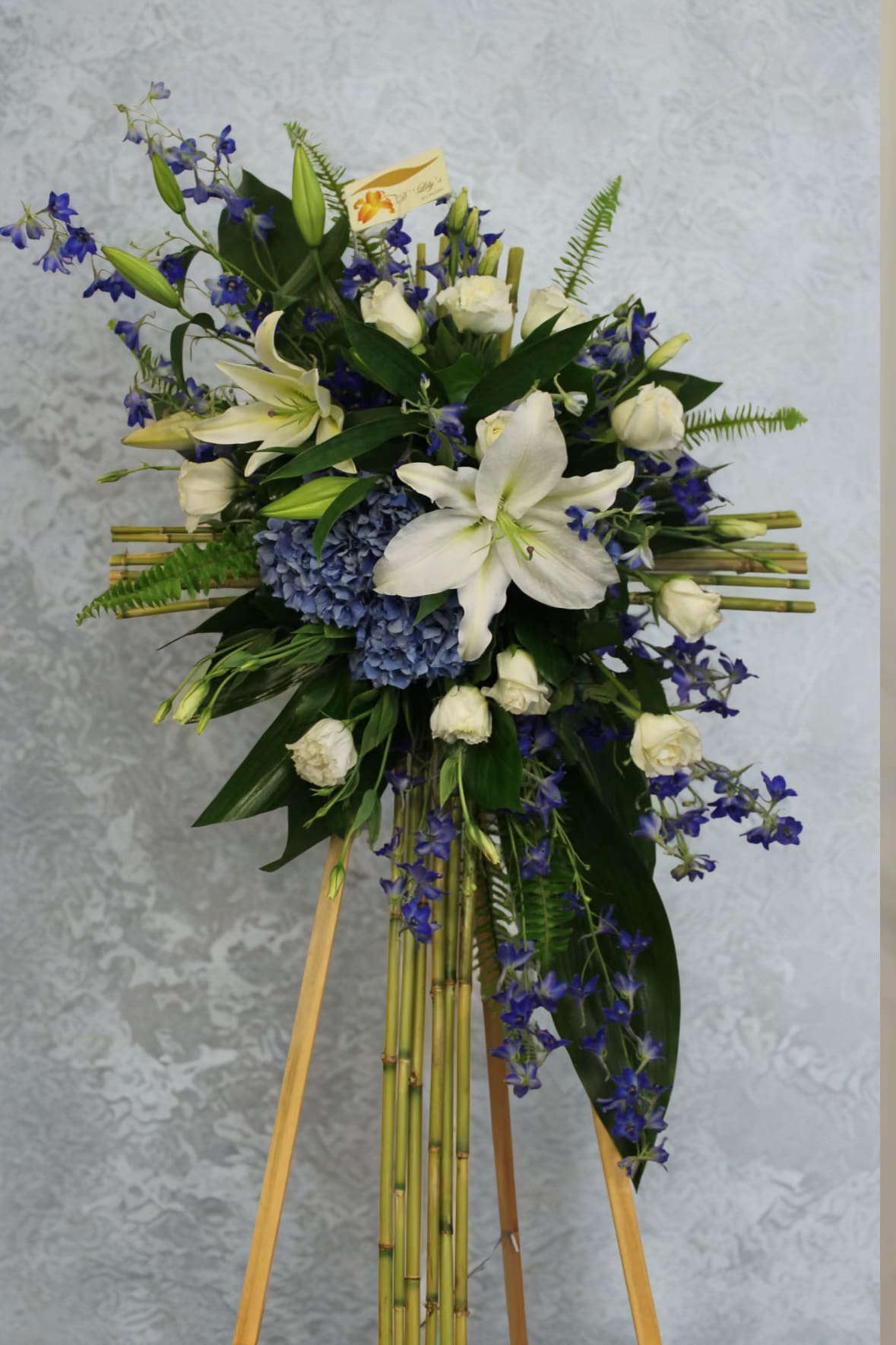 Heavenly - A cross made of bamboo sticks with whites and blues for a unique look.