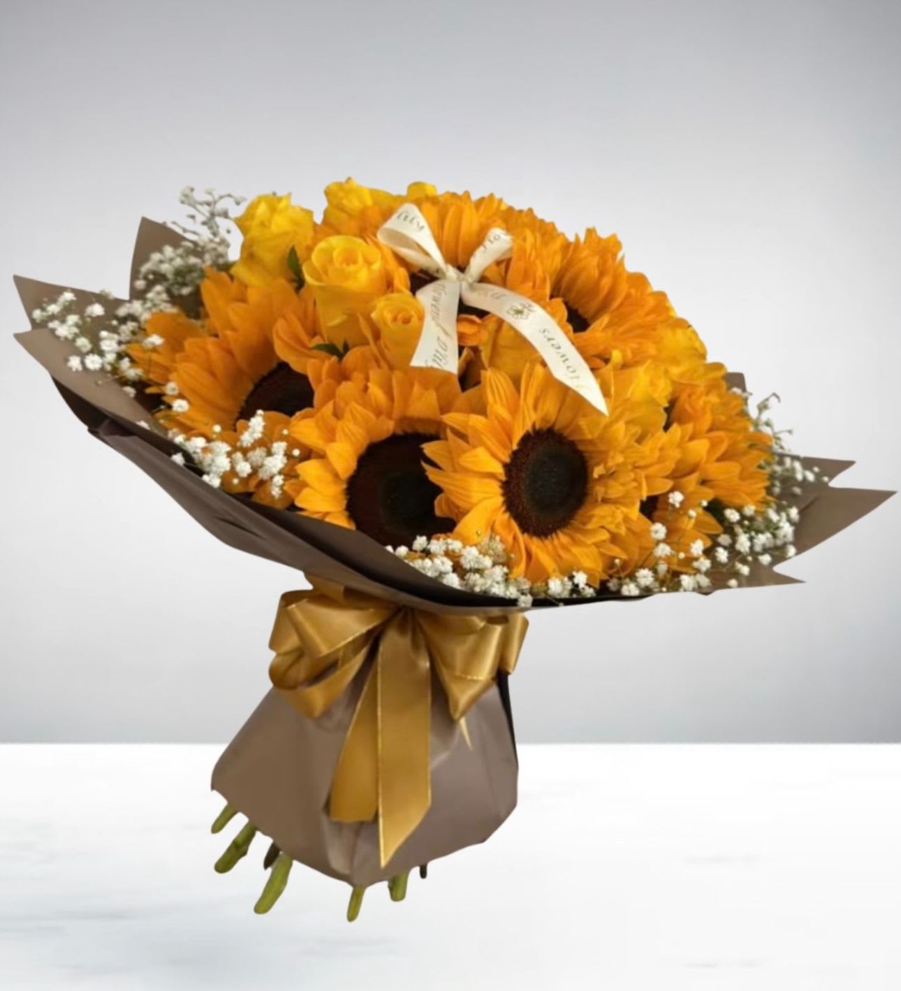 Sunflower Sunlight  by D'Lily's Flowers  - A beautiful bouquet made of yellow roses and stunning sunflowers perfectly put together to bring joy and happiness into that special someone! 