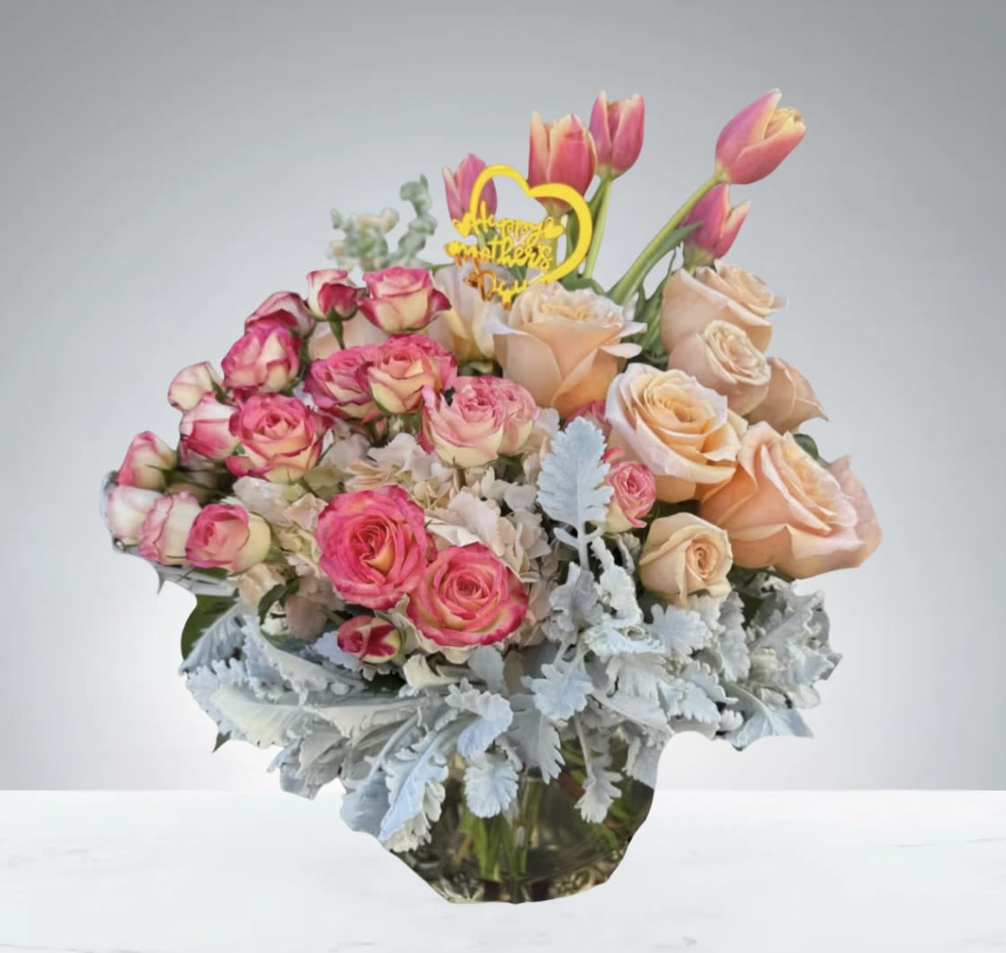 Moms Special  by D'Lily's Flowers  - Mom is always the one to making special treats this beautiful arrangement made of roses, spray roses, hydrangeas, and tulips all bring that special joy that mom always brings around.  Disclaimer: Flowers may be substituted if needed to>. 