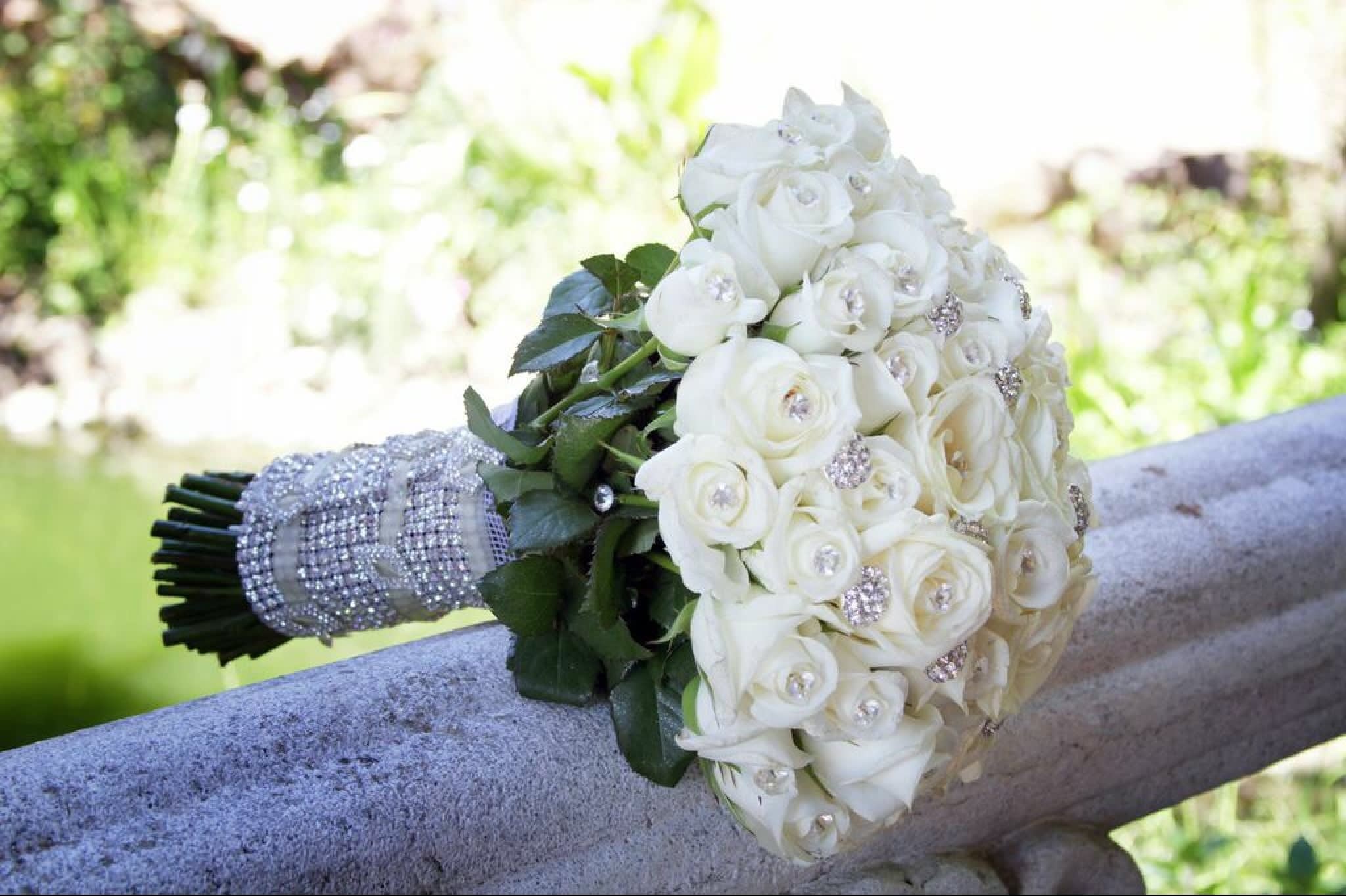 Romance - Lovely all white rose floral bouquet for that elegant touch.