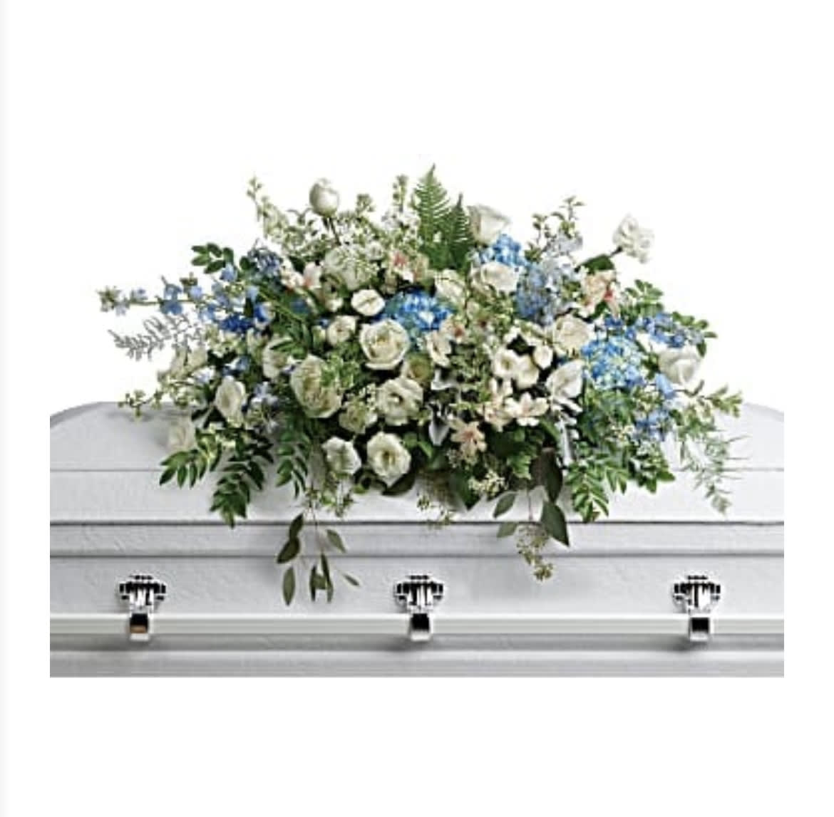 Tender Remembrance Casket  - This breathtaking arrangement of sky blue hydrangea and pure white roses adds a touch of fresh, natural elegance to the casket. It is as gentle and delicate as a fond reminiscence.
