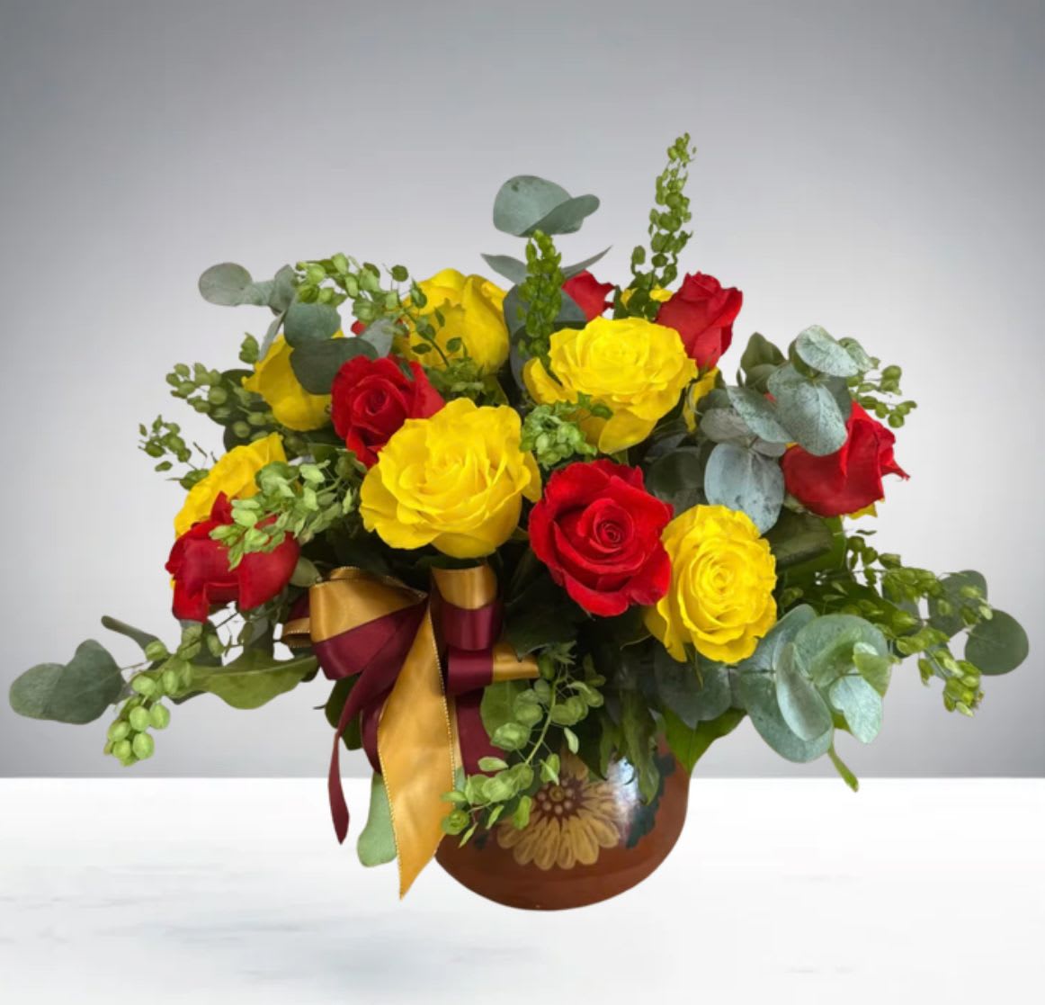 Ollita Flower Arrangement by D'Lily's Flowers - Colores vivos que resaltan en la belleza artesanal de la talavera . Perfecto para regalar cultura y naturaleza en un solo detalle.”