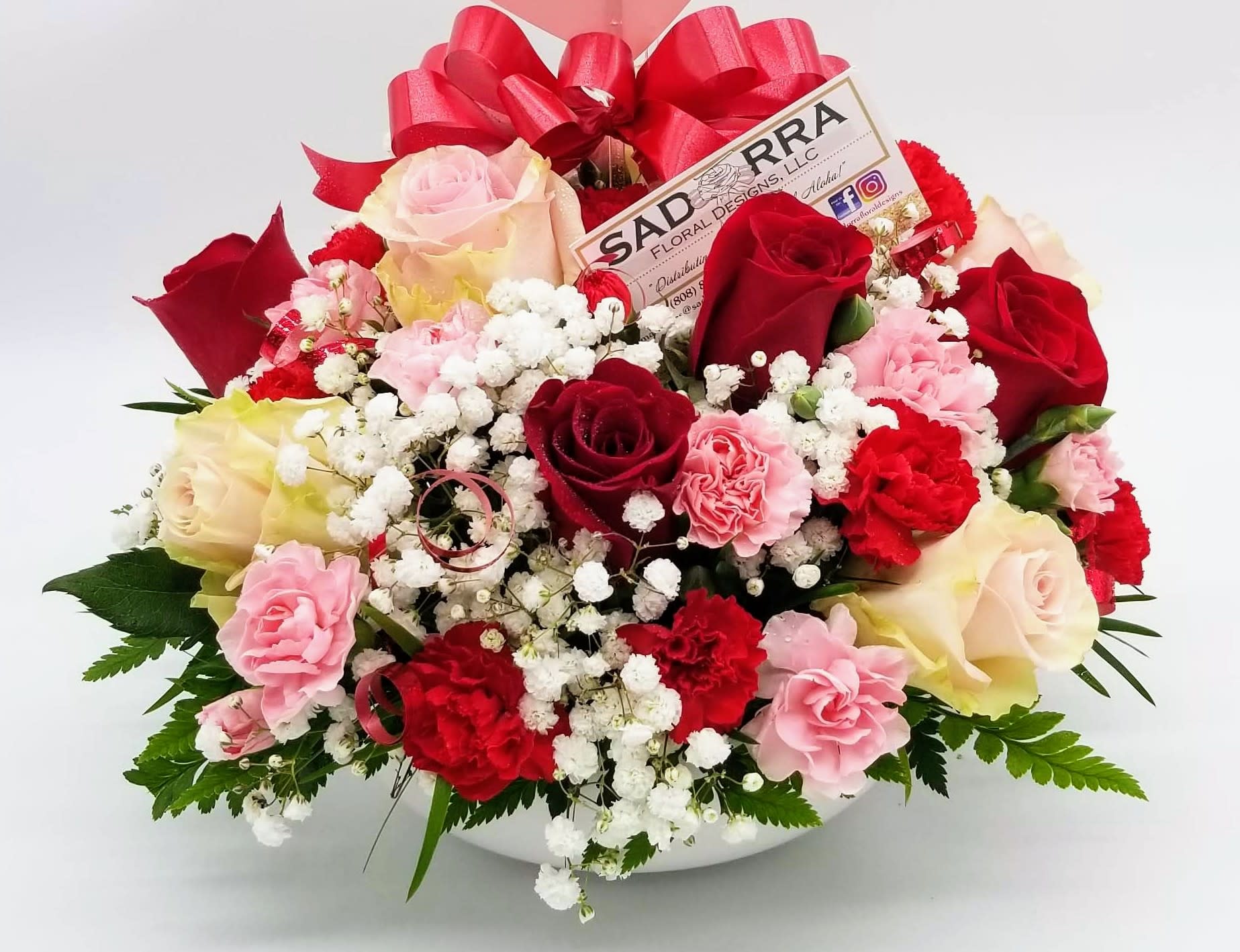 "One Sweet Day" Designer Bowl Arrangement  - A Dozen Rose arrangement with Red &amp; Pink Roses with mini carnations...made for that special someone! (Pink roses may vary in shade) *Designer Bowl color may vary from black, white, or green.