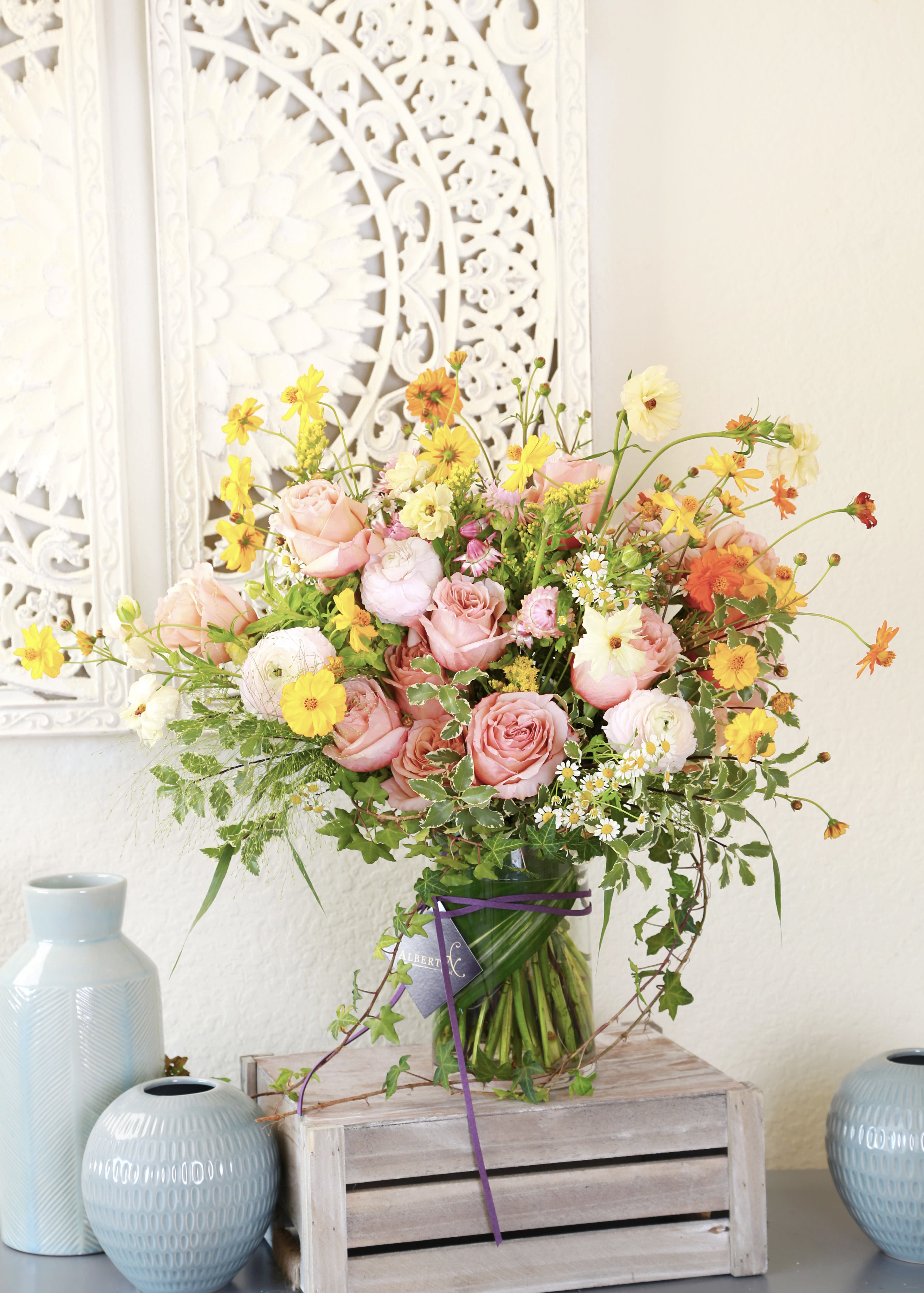 Sunrise Serenity - This exquisite bouquet features delicate coral peachy garden rose, ranunculus, hydrangea with seasonal dancing wildflower and greenery create a whimsical harmonious blend of beauty and fragrance. Perfect for any occasion- be it a birthday, anniversary, or simply to brighten your day. Our bouquet crafted with love and attention to detail, our arrangement are not just flowers, they are expressions of love and happiness. We recommend this arrangement in the tall cylinder vase