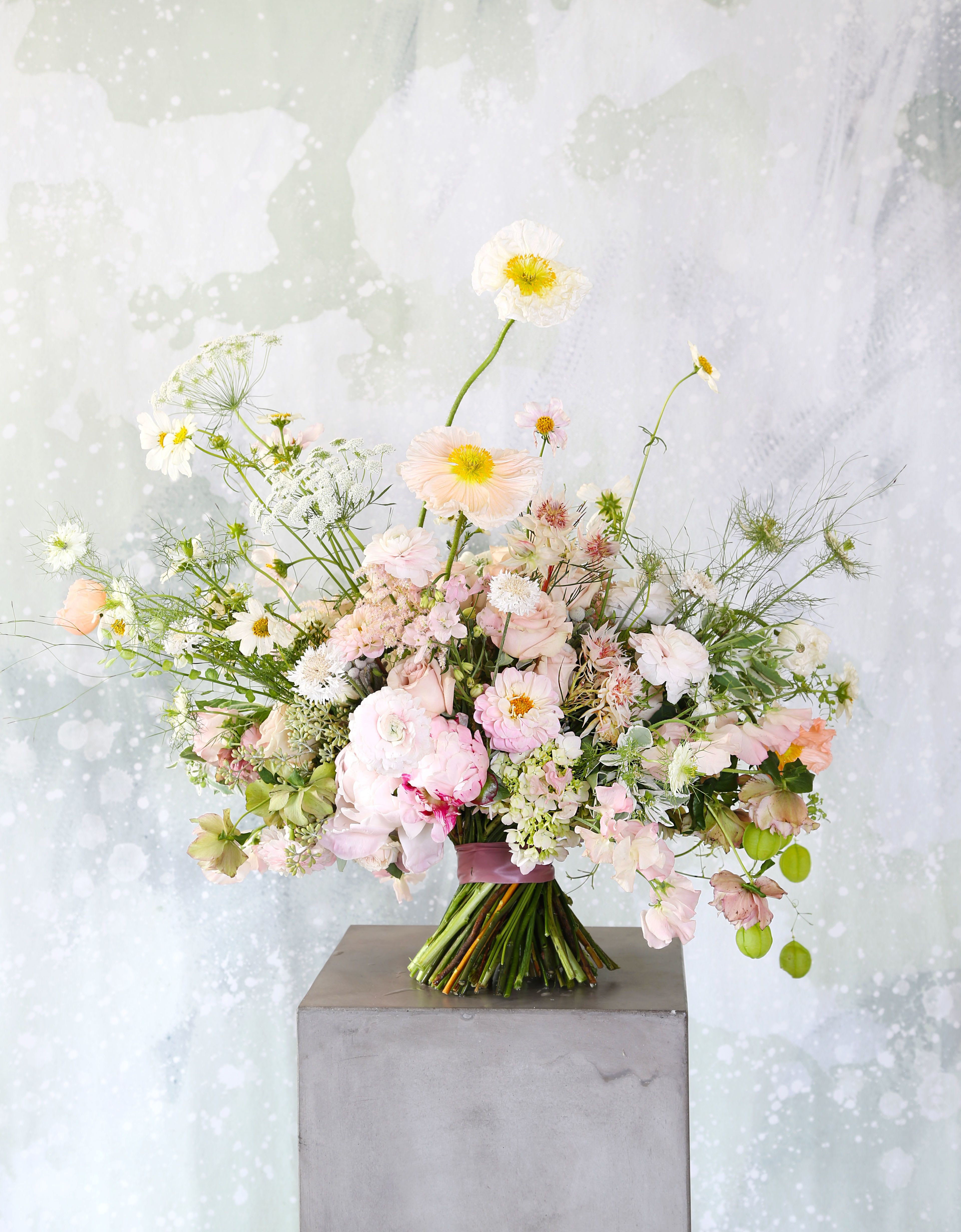 Supreme love  - A soft blush, peach, sand color way which express a very gentle lovely feeling to your loved and family. This is an arrangement for whoever you love and appreciate; this arrangement creates with Garden Rose, spray rose, sweet pea. ranunculus, poppy with seasonal bloom which is very versatile and easy for eyes for everyone, and the sweet pea bring a light delicious fragrant. This arrangement fits for 8" round vase. The arrangement delivered with our Branded Gift box