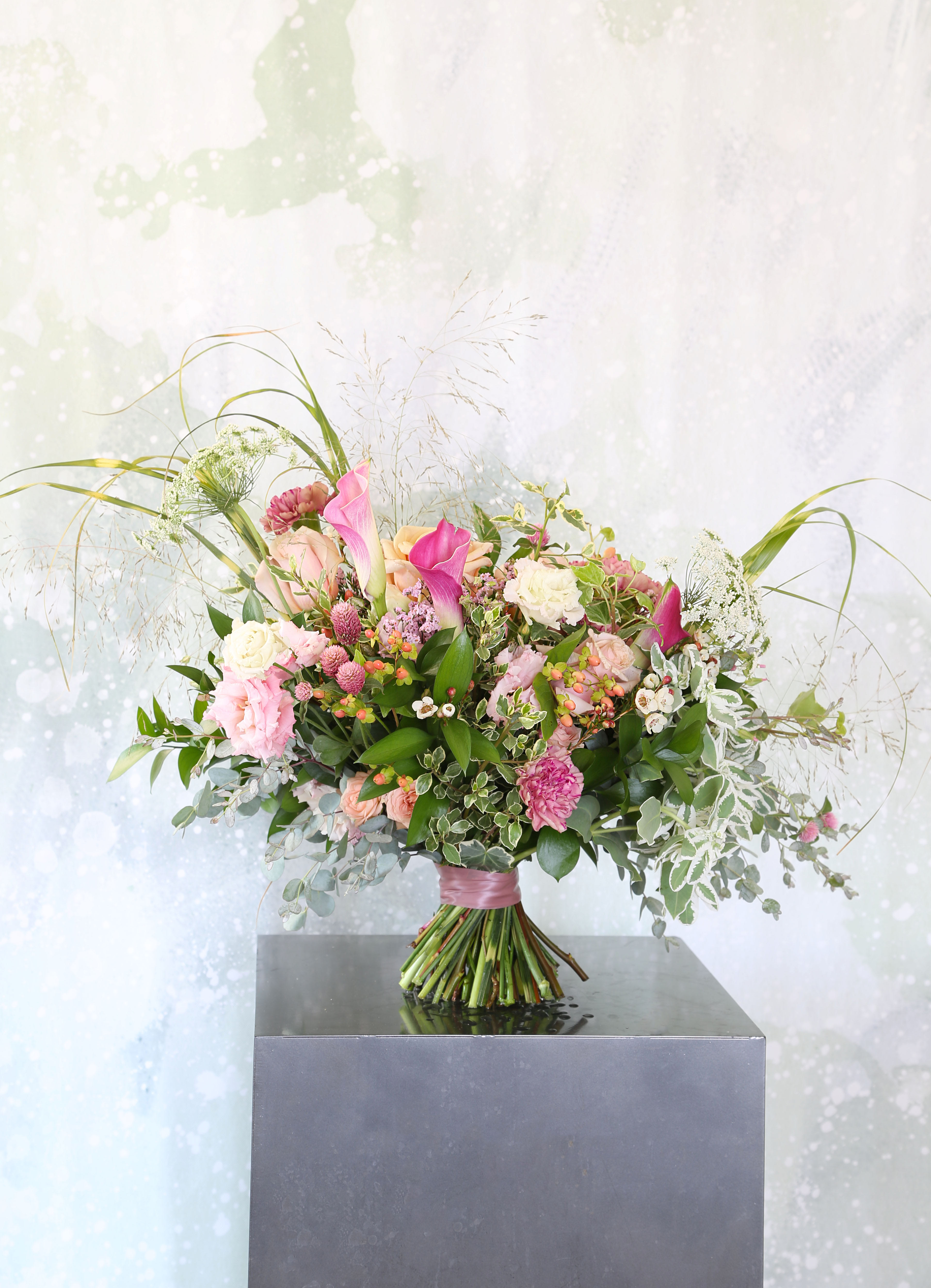 Summer Garden - A Luxury Mix Boquet arrange with garden Rose, Calla lillies, Lisianthus, carnation with 4 variety of green and mix bloom. This Hand- tie bouquet come with 8" round ball glass vase with Branded gift box. 