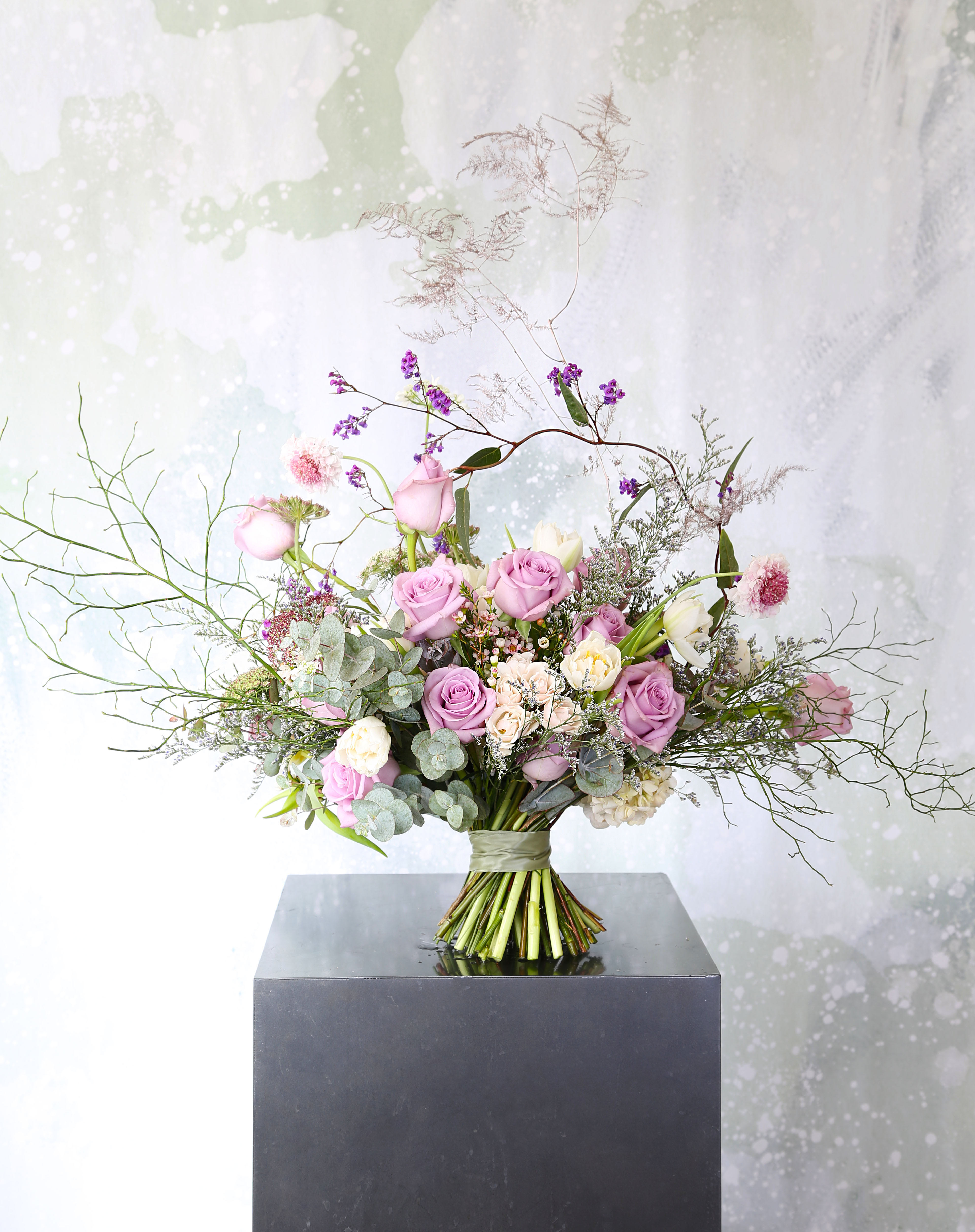 Lavender Tendor - A soft gentle Lavender Ivory color palette create by 2 dozen garden picked rose and double tulip with assorted bloom create a graceful and elegant look with a wild grass touch. This arrangement perfect arrange in 8" round bowl vase, It delivered with gift box and greeting card Disclaimer: Photo just represent the overall style, look and feel, which may not be able to identically replicate in some instance. We will only substitute item of equal value or higher value. 