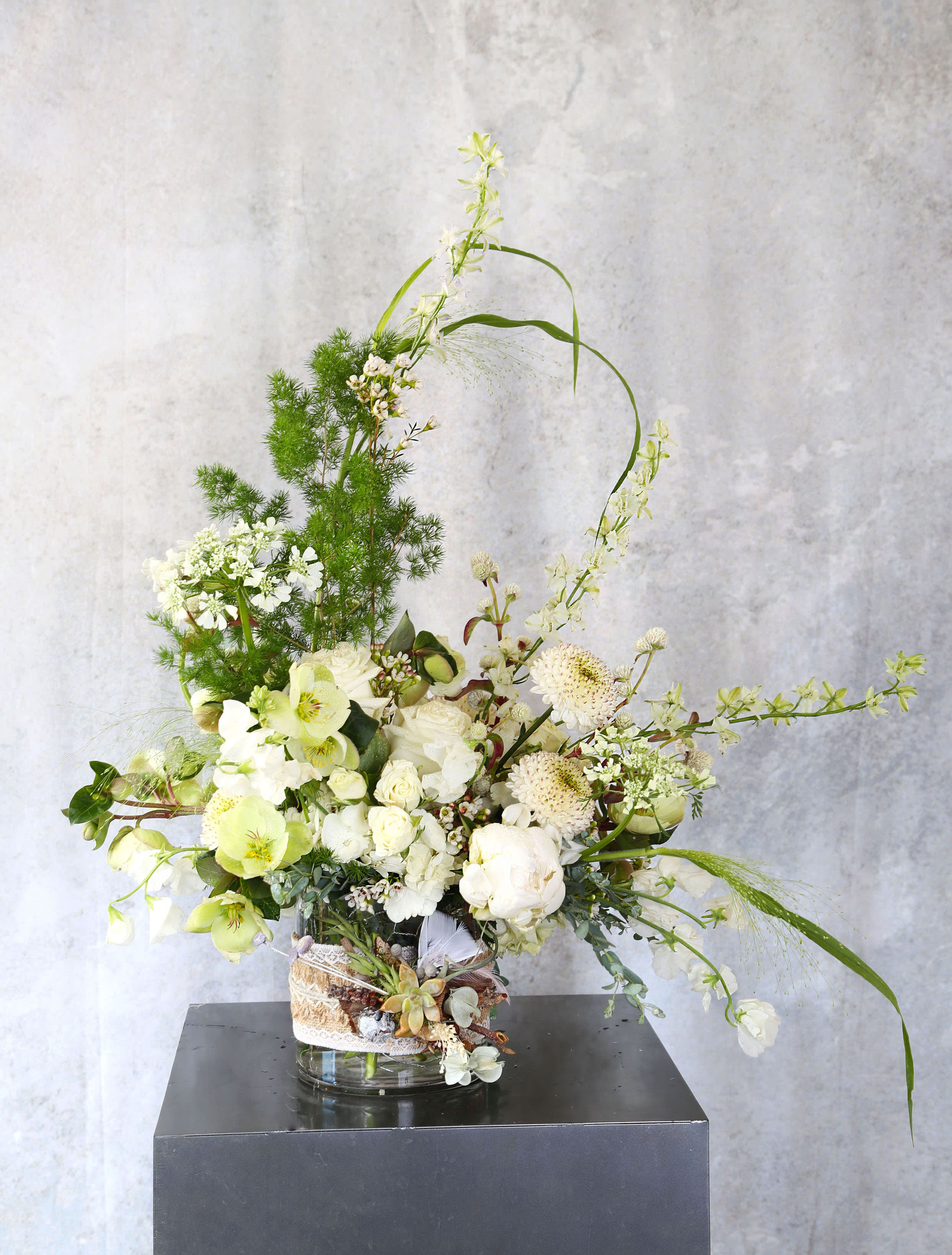 Thinking of you - An elegant luxury arrangement with all precious ivory bloom, such as garden roses, peony, hydrangea and lime heliborne create a very elegant arrangement. This arrangement arranges in 5" cylinder with hand warp burlap and woodland handcraft succulent to add the details decor and the uniqueness of the one you care. This healing arrangement is perfect for the center piece or countertop or coffee table  Disclaimer: Photo just represent the overall style, look and feel, which may not be able to identically replicate in some instance. We will only substitute item of equal value or higher value. 