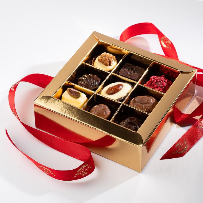 AJ Chocolate House 9pc Window Box - Assortment of Chocolates in a 9pc window box. Inside, they’ll discover gourmet, handcrafted chocolates, made with love and the finest ingredients.
