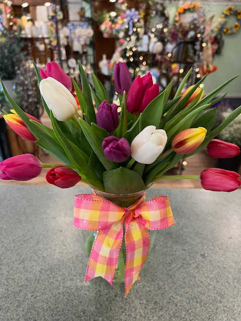 Rainbow Tulips (RT) -  Assorted colored tulips in a vase, finished with an accenting bow make up up this cheerful vase.