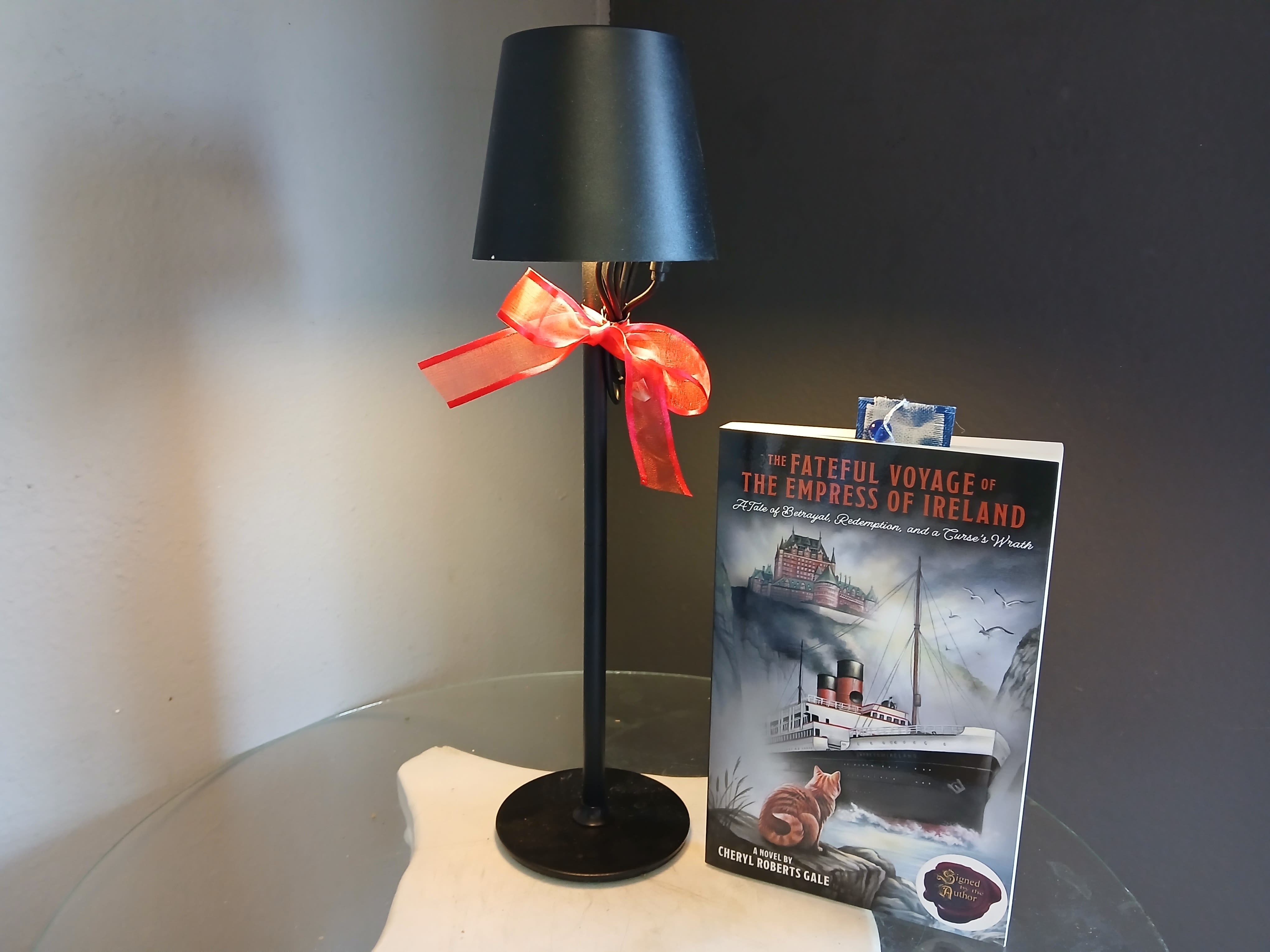 Book Club - The Fateful Voyage of the Empress of Ireland - This gift set is sure to dazzle the bookworm in you life. Featuring The Fateful Journey of the Empress of Ireland, a history  mystery. This beautiful flower arrangement of fresh mixed seasonal blooms is made by local designers in the heart of Orange California. Hand crafted and perfect for every occasion, from birthdays and new babies to sympathy and just because. The best choice to show you are thinking of that special someone. Can be sent as a local delivery or in-store pickup. This is an original, one of a kind arrangement. Order now before it's too late!  This set also includes an LED rechargeable lamp to ensure the best lighting for reading.