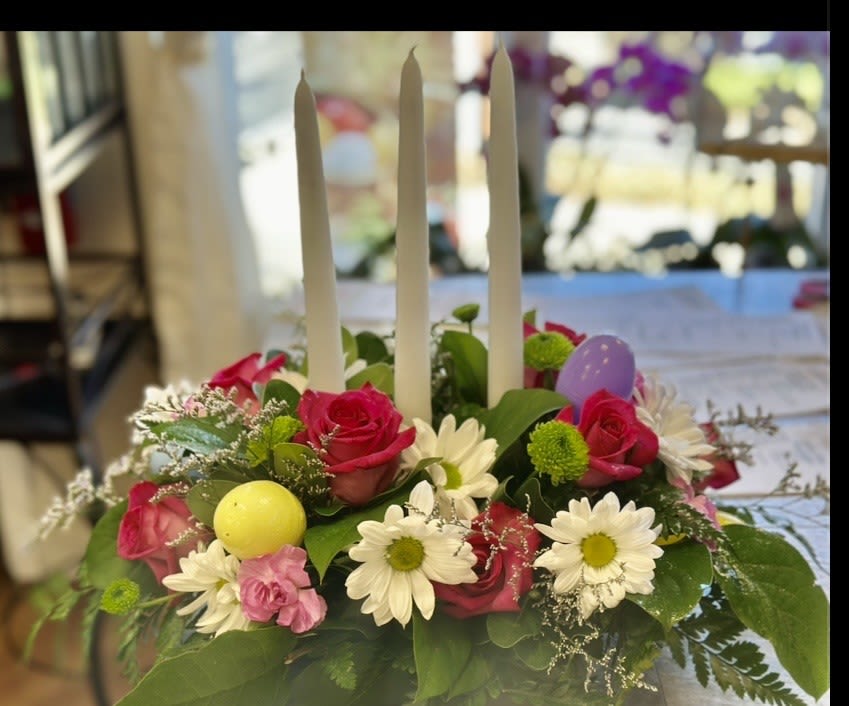 EASTER PARADE CNTERPIECE - BEAUTIFUL EASTER CENTERPIECE WITH PLASTIC EGGS, CANDLES, GREENS DAISIES CARNATIONS AND ROSES  SURE TO GRACE YOUR TABLE FOR YOUR EASTER MEAL