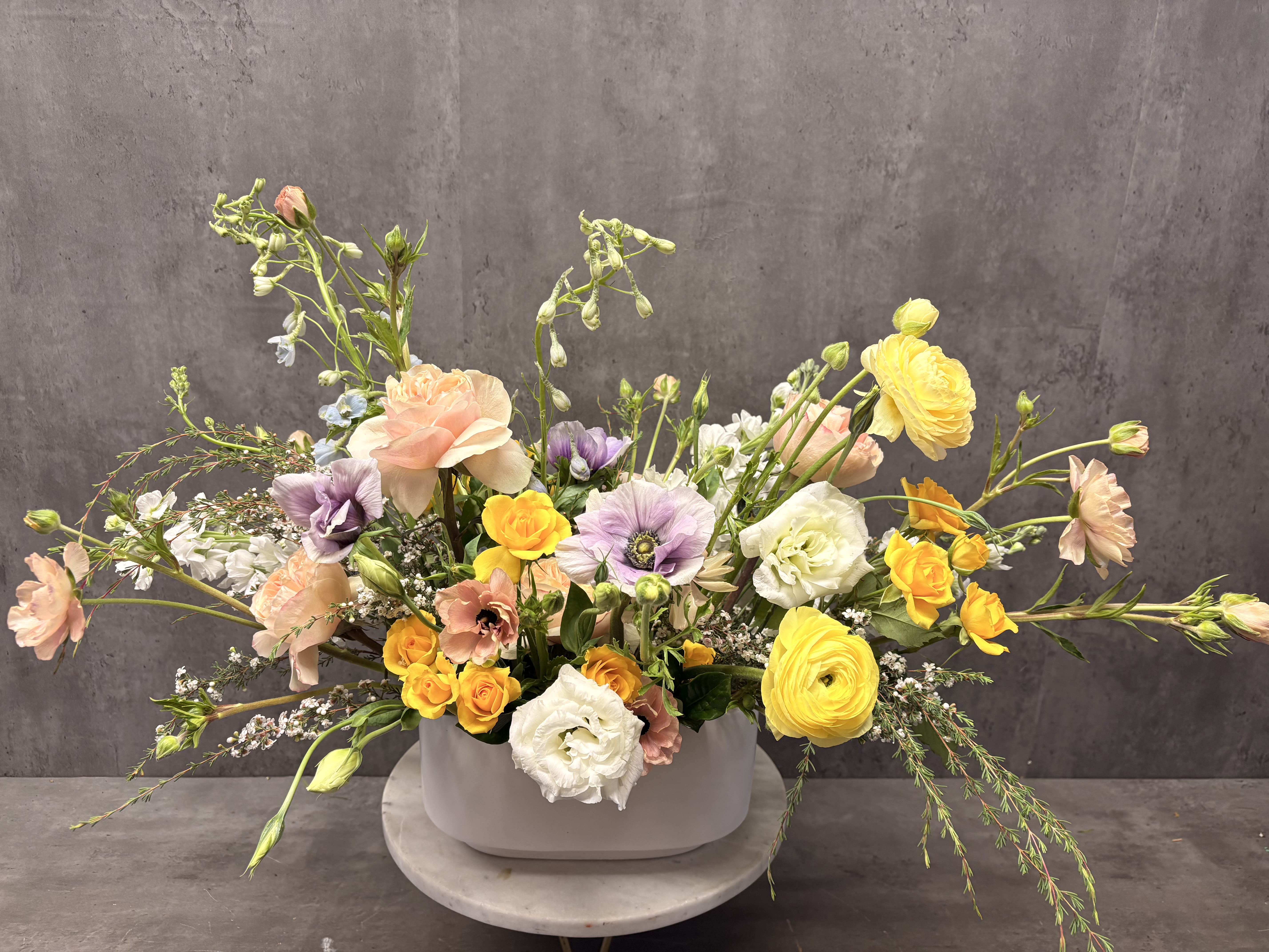 Spring Love - A beauty built to grace your table. Created with the the most beautiful Spring flowers.  ***Please note that we may substitute flowers and containers based on availability, however the overall feel will remain the same. ***