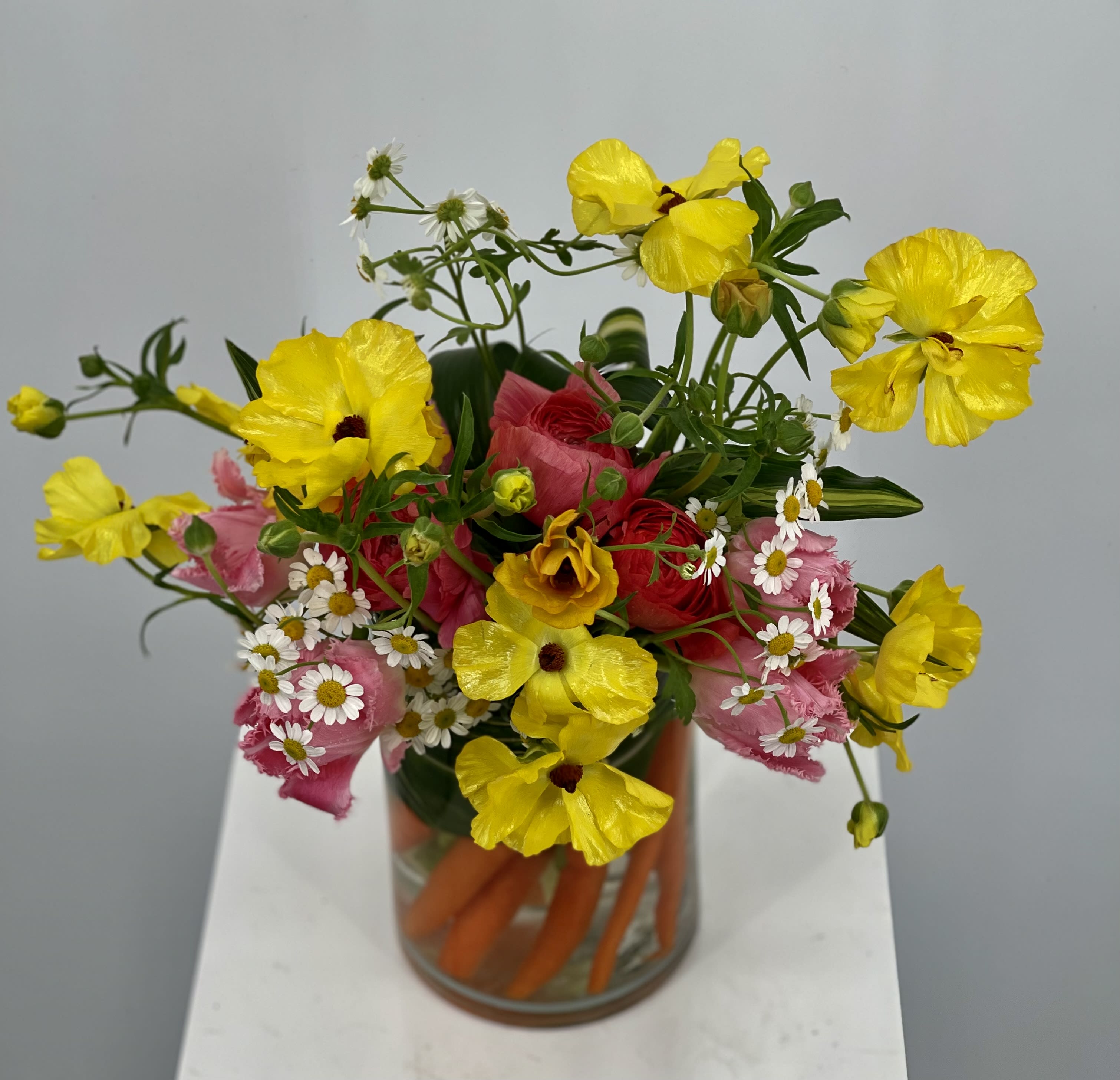 Tomas - Whimsical Easter delight ready for any occasion the spring. Filled with flowing flowers and plenty of greenery to catch every angle. This centerpiece will bring joy to anyone who sees it.