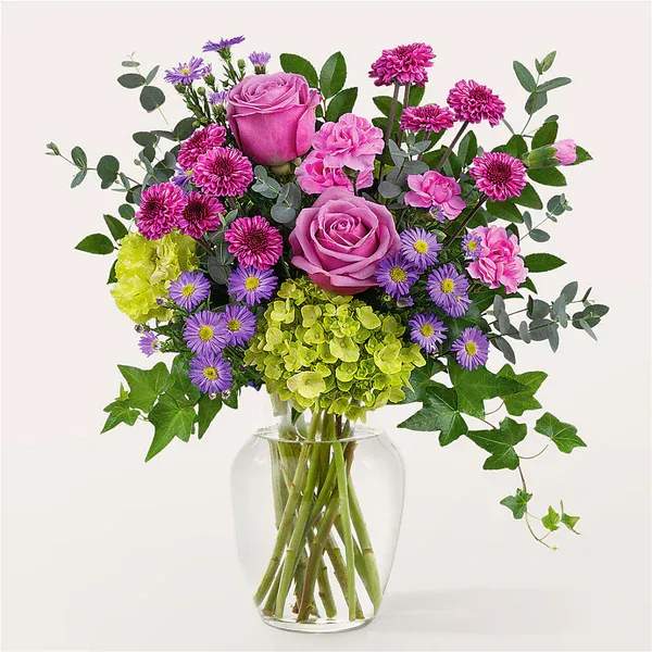 Whispering Garden Bouquet - An exquisite balance of purple and green stems are masterfully arranged, creating the aroma and feel of your favorite backyard garden.  Details Designed by florists, ready to display. For long–lasting blooms, replace the water daily. We suggest trimming the stems every couple days. Pet Safety Precautions: This bouquet or plant may include flowers and foliage that are known to be toxic to pets. To keep them safe, be sure to keep this arrangement out of your pet's reach.