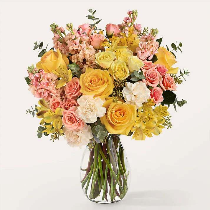 Slice of Sunrise Bouquet - Like opening the windows to a sparkling morning, this mix of light yellows and peach is a positive way to start their day.  Details Designed by florists, ready to display. For long–lasting blooms, replace the water daily. We suggest trimming the stems every couple days. Pet Safety Precautions: This bouquet or plant may include flowers and foliage that are known to be toxic to pets. To keep them safe, be sure to keep this arrangement out of your pet's reach.