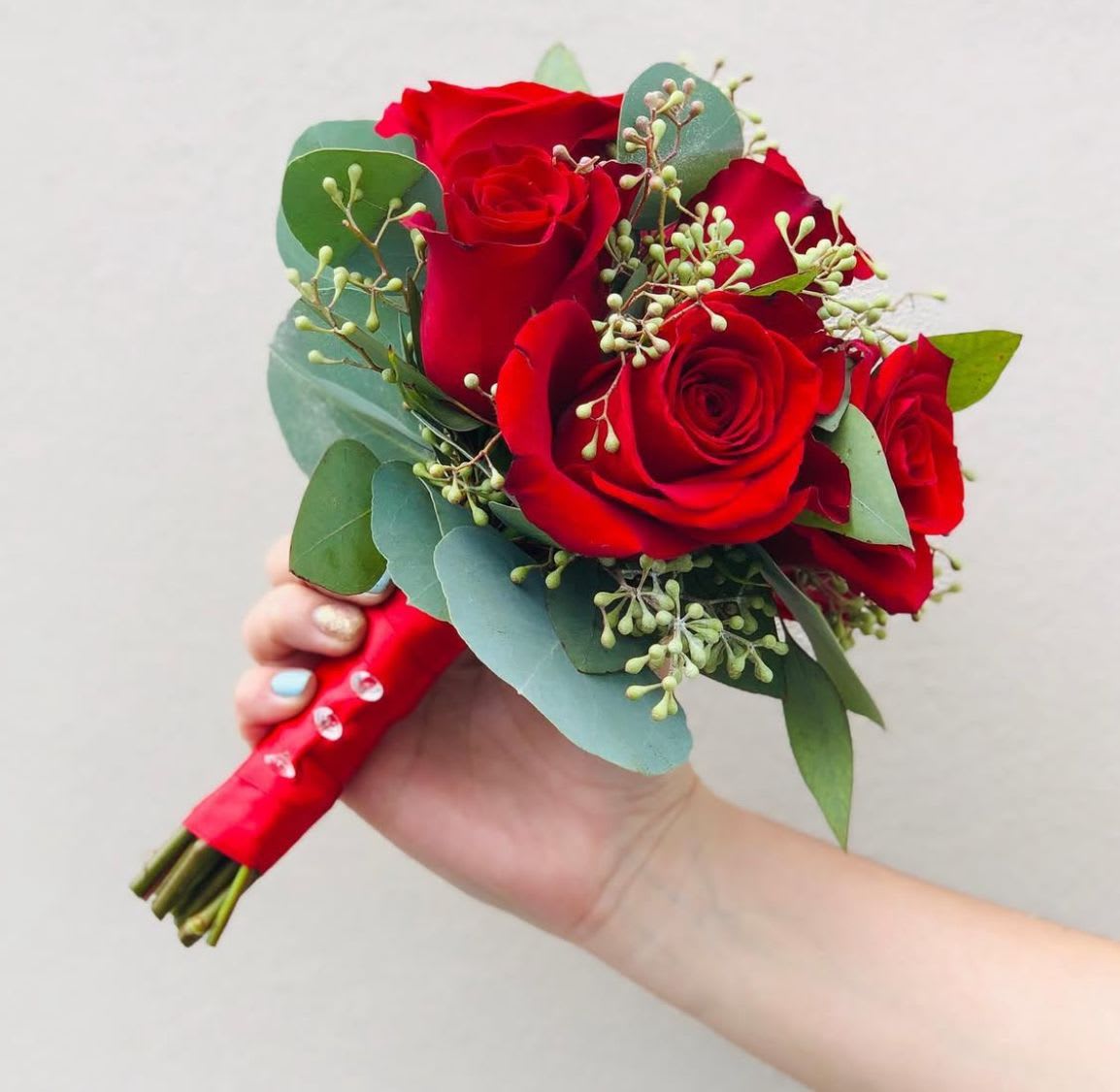 Small HOCO/PROM Bouquet (Most Popular) - Small  Rose Bouquet – Perfect for Homecoming &amp; Prom Make your special night unforgettable with this elegant mini bouquet, designed to complement your look without overwhelming it. Featuring 5–7 fresh premium roses, accented with lush greenery, this bouquet is the perfect accessory for homecoming, prom, or any formal occasion. Personalize your bouquet with your choice of ribbon color to match your dress or theme, adding a touch of custom detail that ties it all together. Delicate, timeless, and perfectly sized for carrying, this petite rose bouquet is the ideal finishing touch for your night to remember.  Please list your color preference in the notes and we will make it to match!  Please check out our Add-On option for custom HOCO Ribbons!