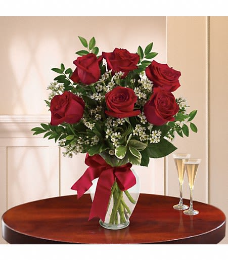 Thoughts Of You Deluxe - It's the thought that counts, but it counts a bit more when it is expressed with three gorgeous red roses in a lovely arrangement tied up with a red satin ribbon. The flowers are bright and the price is right - the perfect combination for a sweet surprise