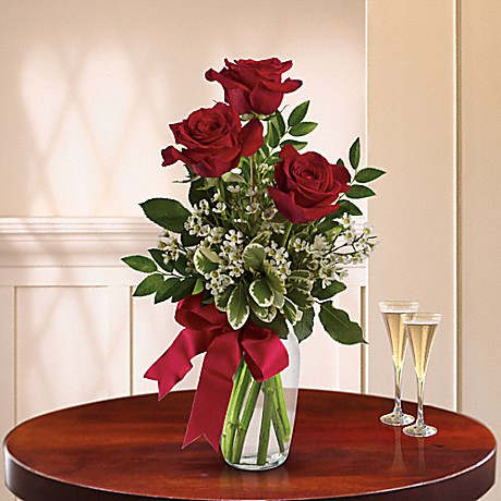 Thoughts of You Standard - It's the thought that counts, but it counts a bit more when it is expressed with three gorgeous red roses in a lovely arrangement tied up with a red satin ribbon. The flowers are bright and the price is right - the perfect combination for a sweet surprise