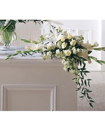 Graceful Tribute Arrangement - When searching for an appropriate bouquet for the home this lily rose and gladiolus arrangement is an excellent choice. Width: 10"h x 34"w   FCS35-3183