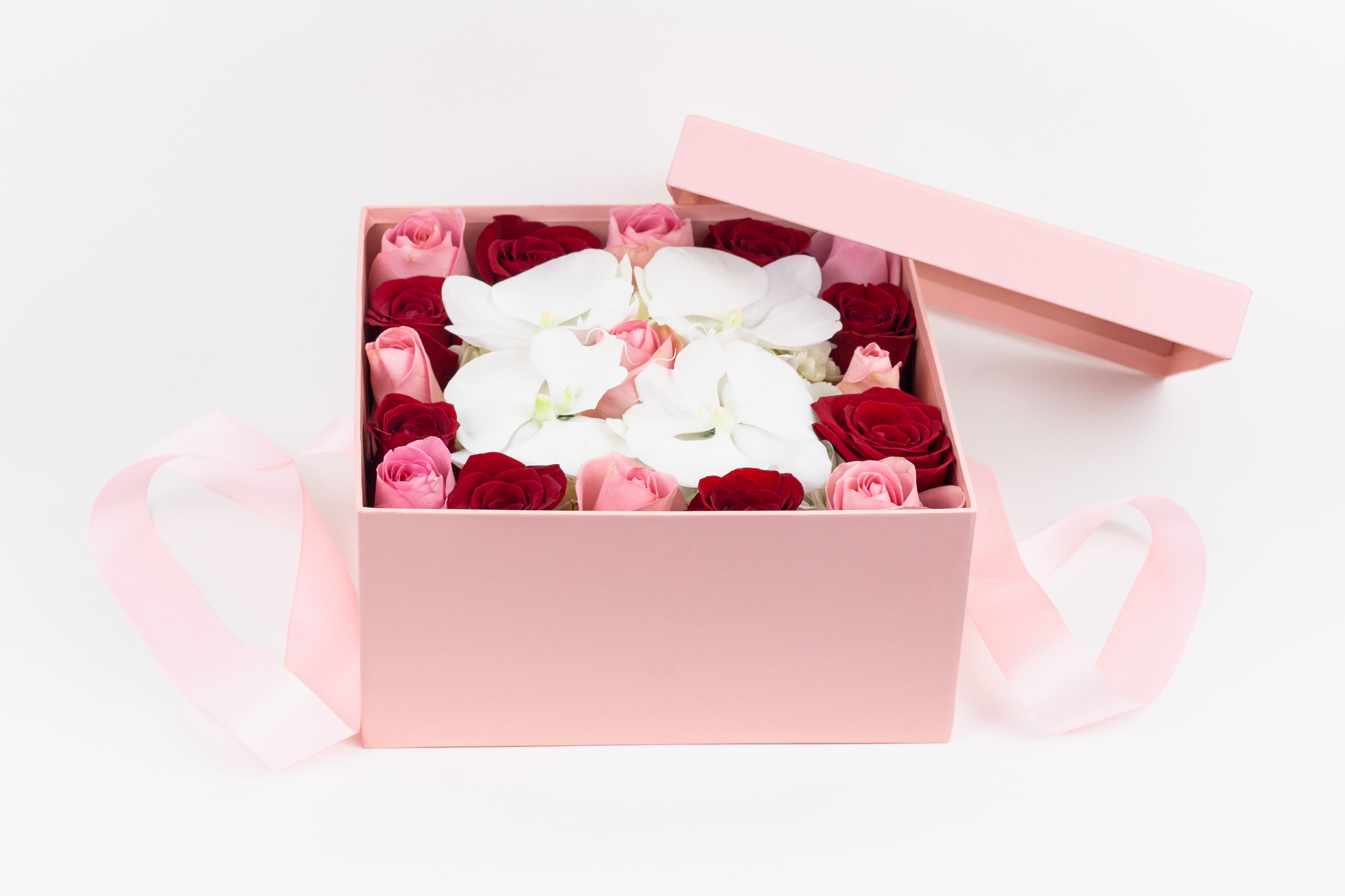 Box Full of Love - A luscious selection of roses, hydrangeas and orchids in a romantic pink box.