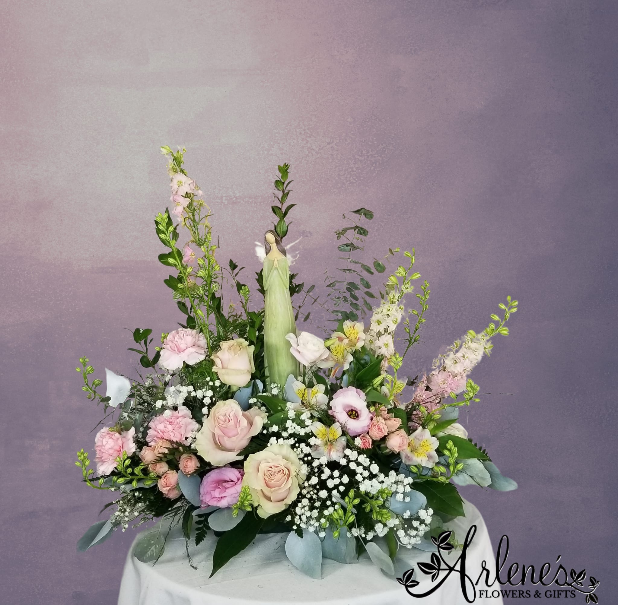 Garden Angel - A serene angel in a garden of soft and soothing flowers. Angels and flowers will vary, but we will always seek to send something sweet to gaze upon during your loved one's time of sorrow.