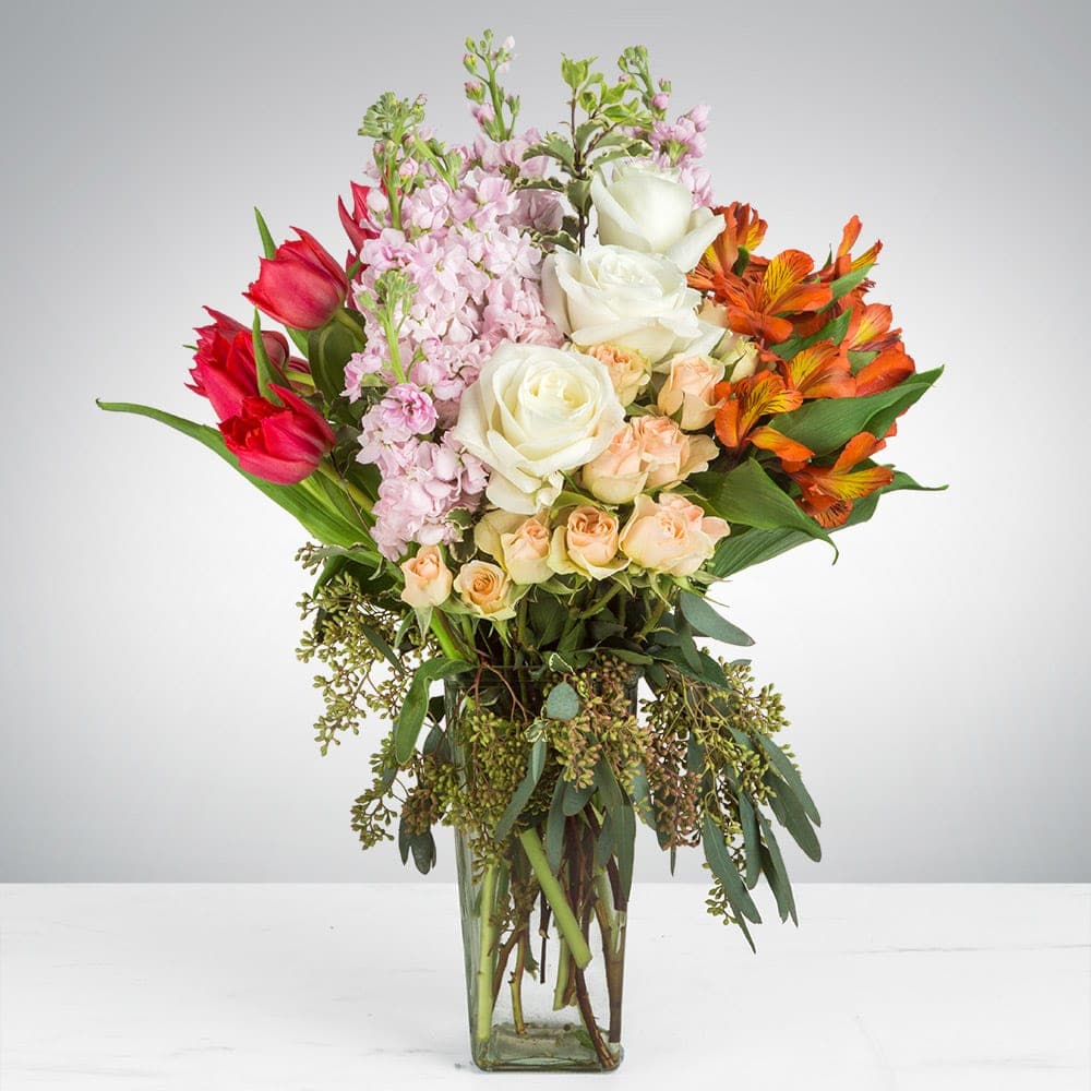 Soft Burn  - This arrangement contains alstroemeria, tulips, roses, and other seasonal blooms. APPROXIMATE DIMENSIONS: 13" L x 11" W x 22" H