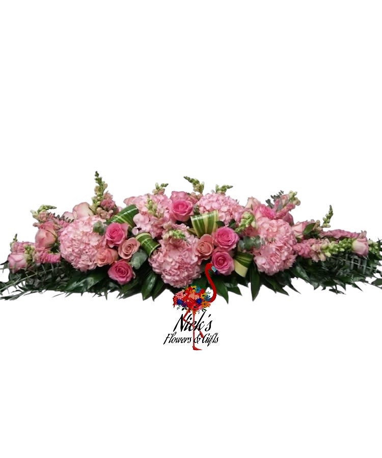 Long pink floral arrangement with roses and hydrangeas