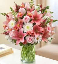 Florist Choice Pink Sympathy Arrangement - A soft and elegant florist-choice sympathy arrangement featuring a beautiful selection of fresh seasonal flowers in varying shades of pink, thoughtfully chosen by our florists for quality and design. Accented with fresh greenery, this arrangement creates a comforting and graceful display to honor a loved one.  Each design is uniquely handcrafted using the freshest flowers available, offering a heartfelt expression of love, remembrance, and sympathy during a difficult time. 