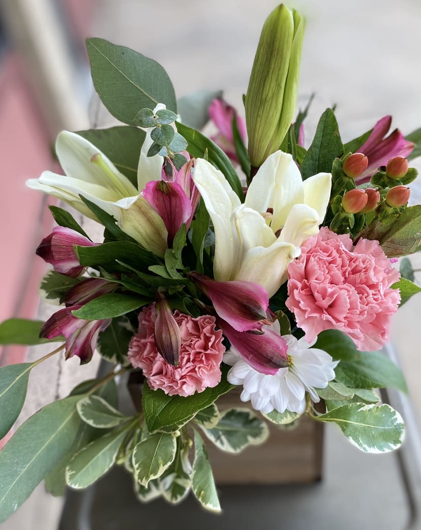 Designer's Choice  -Traditional - *** The photo is example but due to high demand, the bouquet delivered may not have the flowers or colors included in the l listing photo.****  Everything is blooming red, white, purple and pink! We have so many spectacular things we can’t possibly put them all on the website. Pick a designers choice and we will pick the most fabulous design for you!   *****Florist choice of container will be either a clear vase, white metal pot or box. 