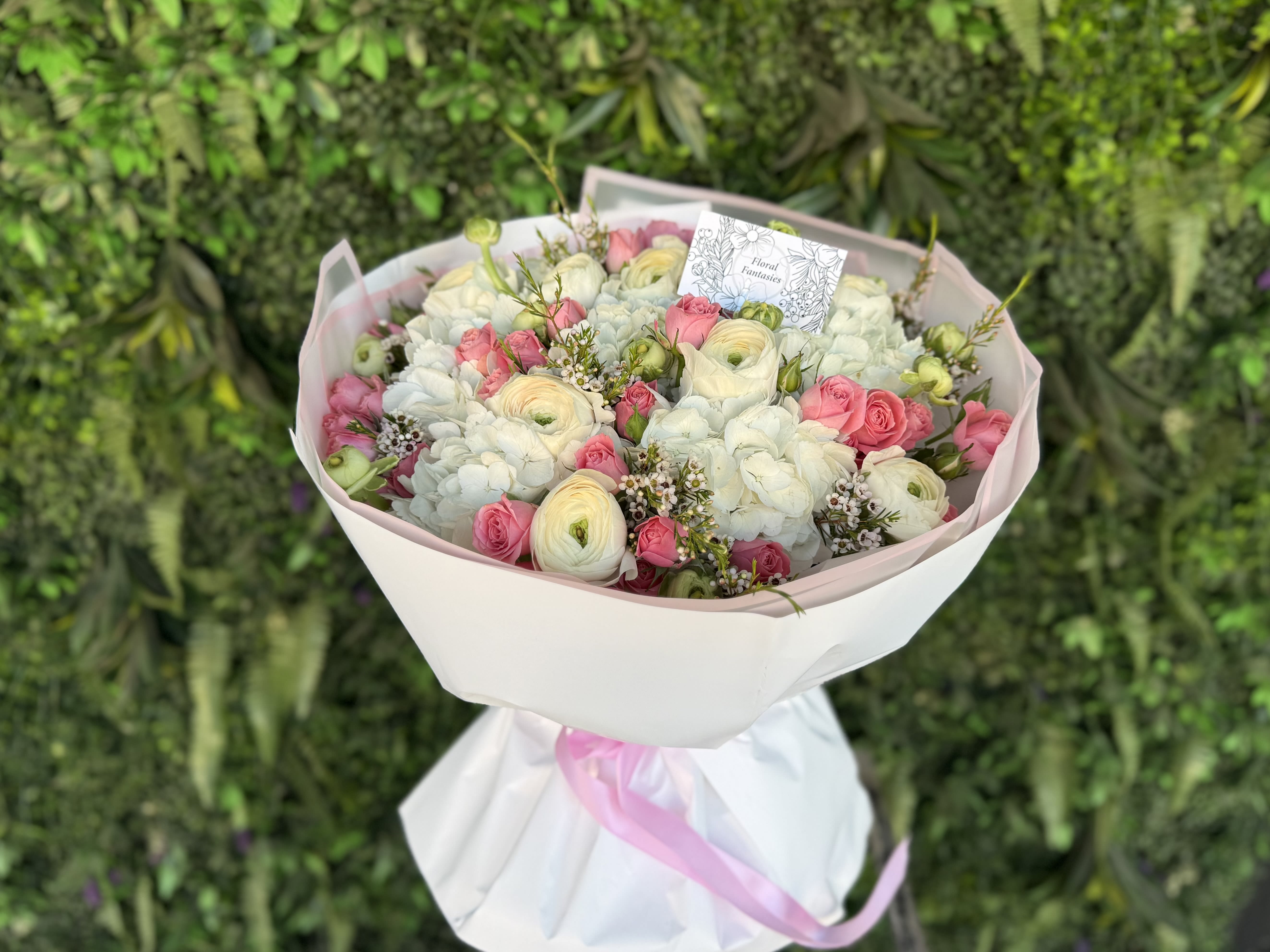 Summer Kiss - An elegant floral arrangement featuring a blend of pure white and vibrant blooms. Perfectly balanced in color and style, it brings freshness, beauty, and a touch of sophistication to any occasion